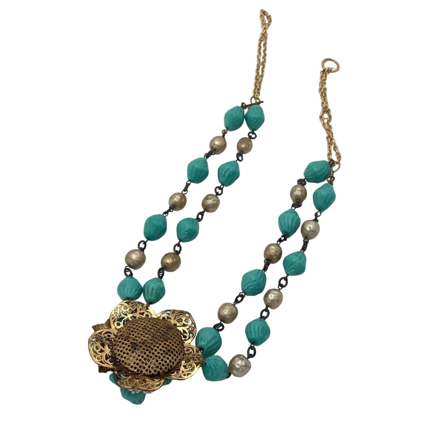 Necklace with turquoise beads and a gold clasp on a white background