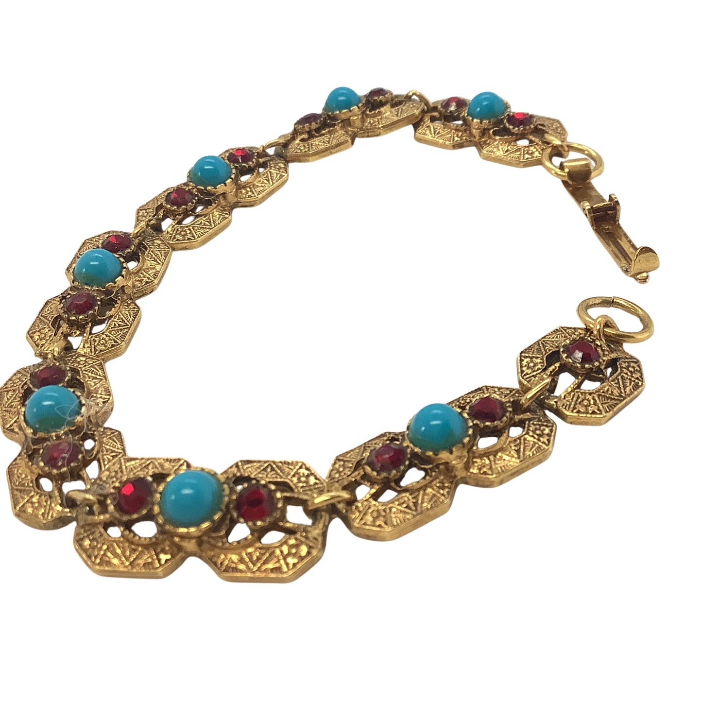 Gold tone faux turquoise coral bracelet detail view on a white background