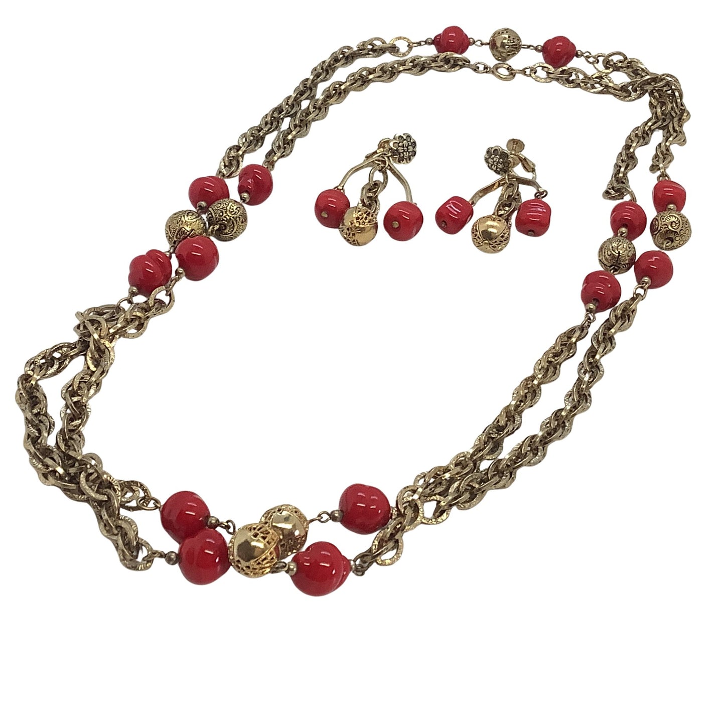 Necklace with red beads and gold chain on a white background