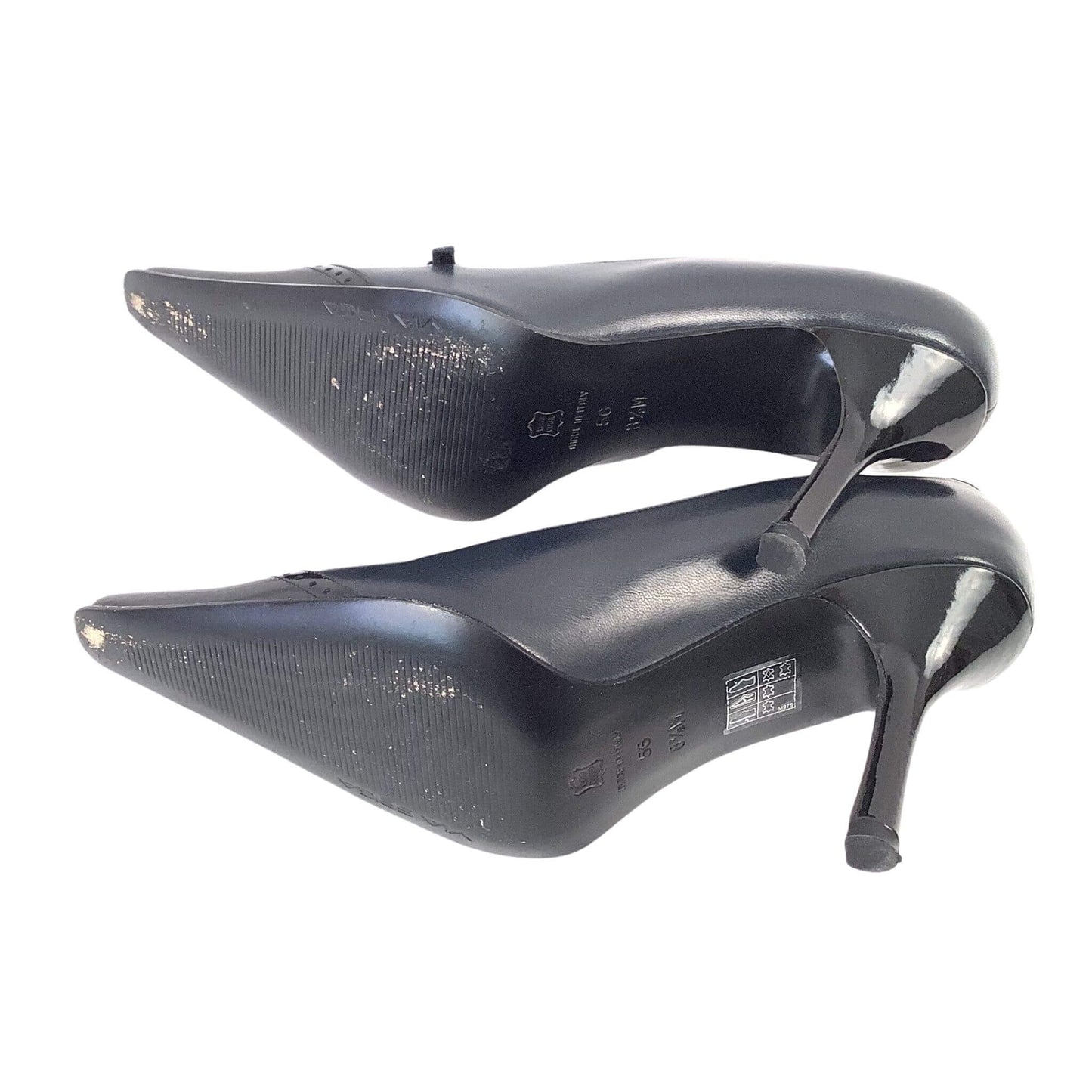 Pair of black Via Spiga high-heeled shoes view of soles on a white background