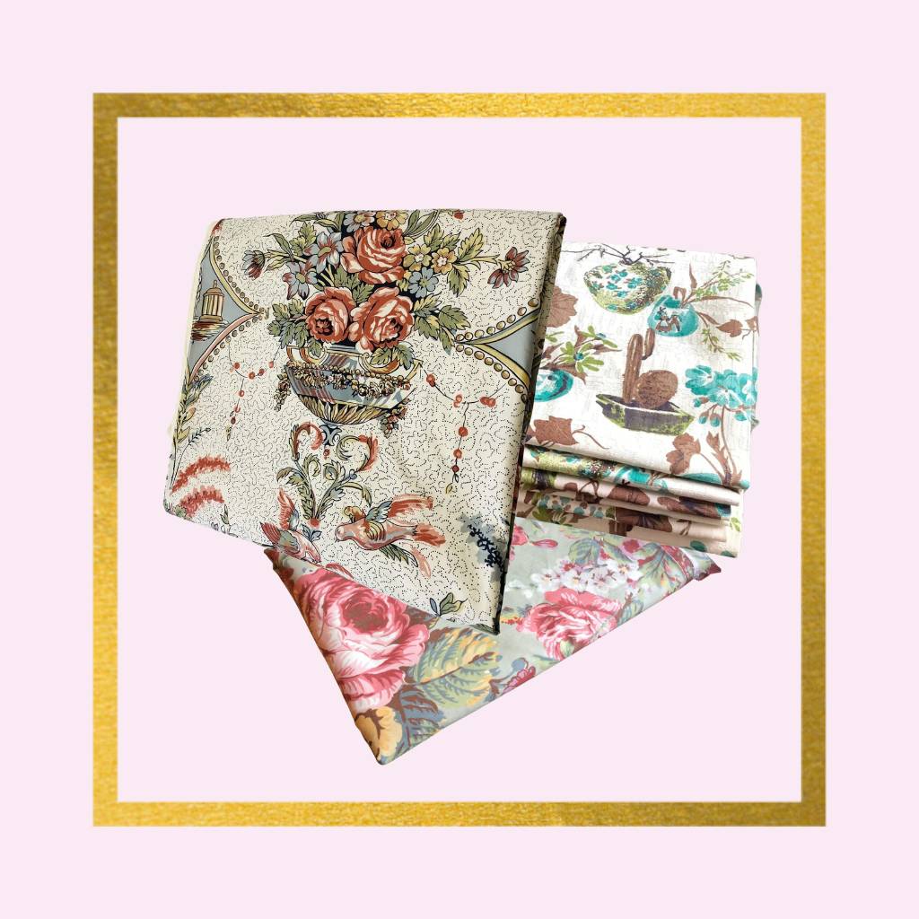 three vintage fabric pieces folded