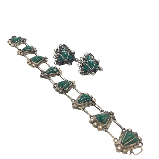1930s Mexican sterling jewelry set on a white background