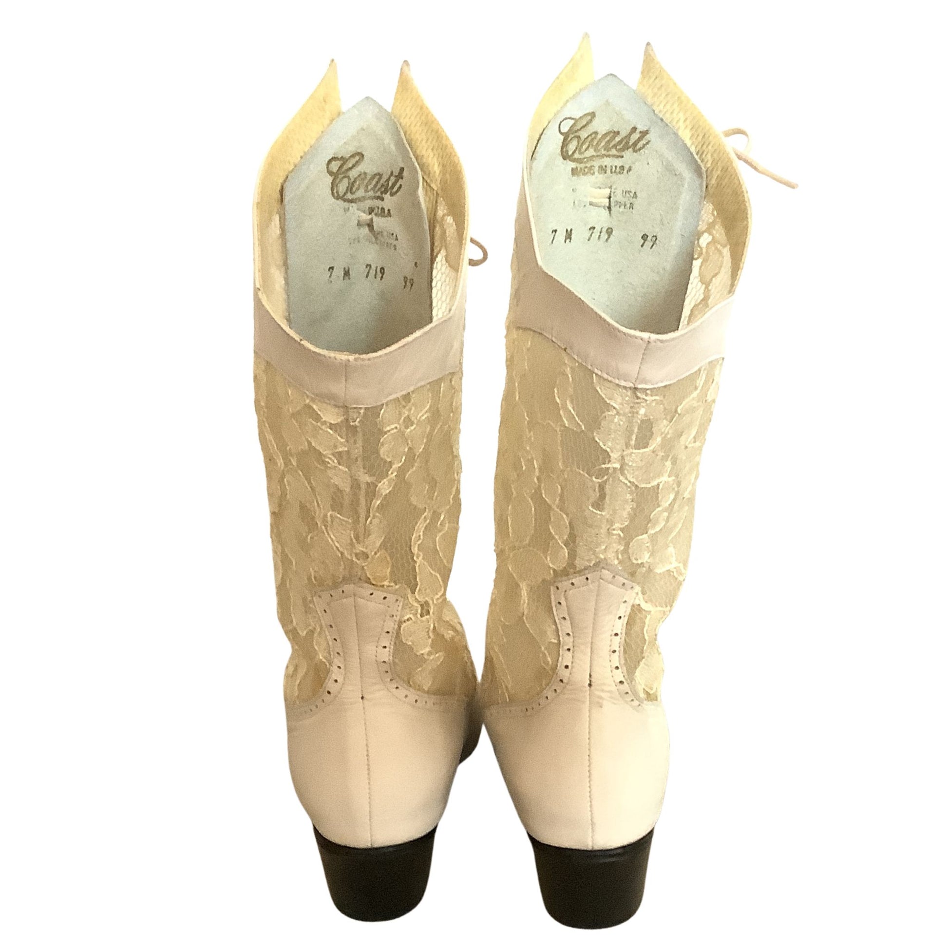 Back View Pair of vintage lace-up boots with brand name on white background