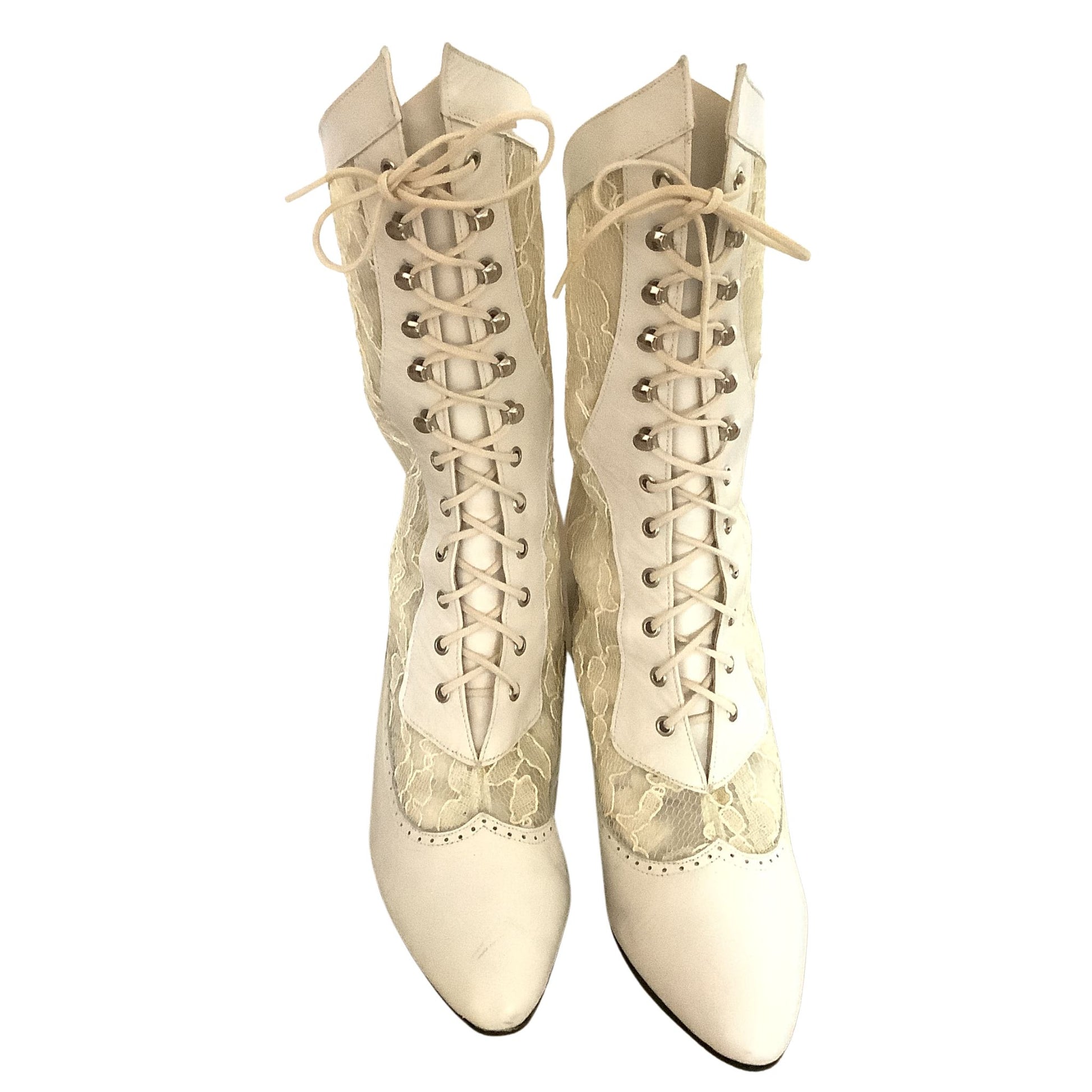 Front View Pair of white lace-up boots on a white background