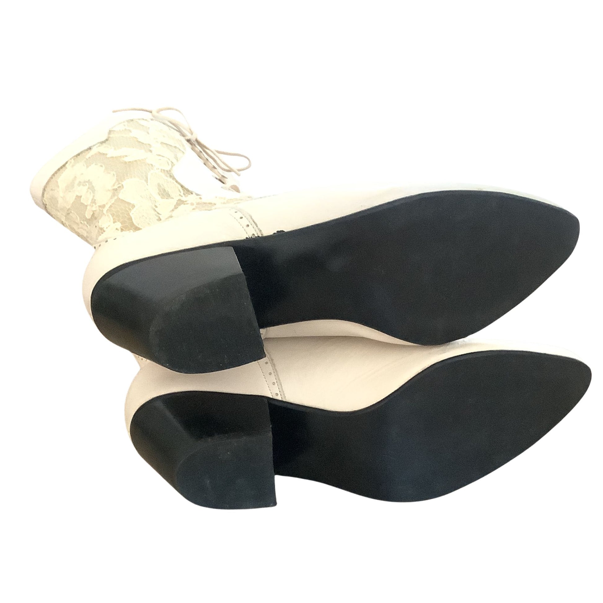 Black Sole Bottom White lace-up boots on a white background