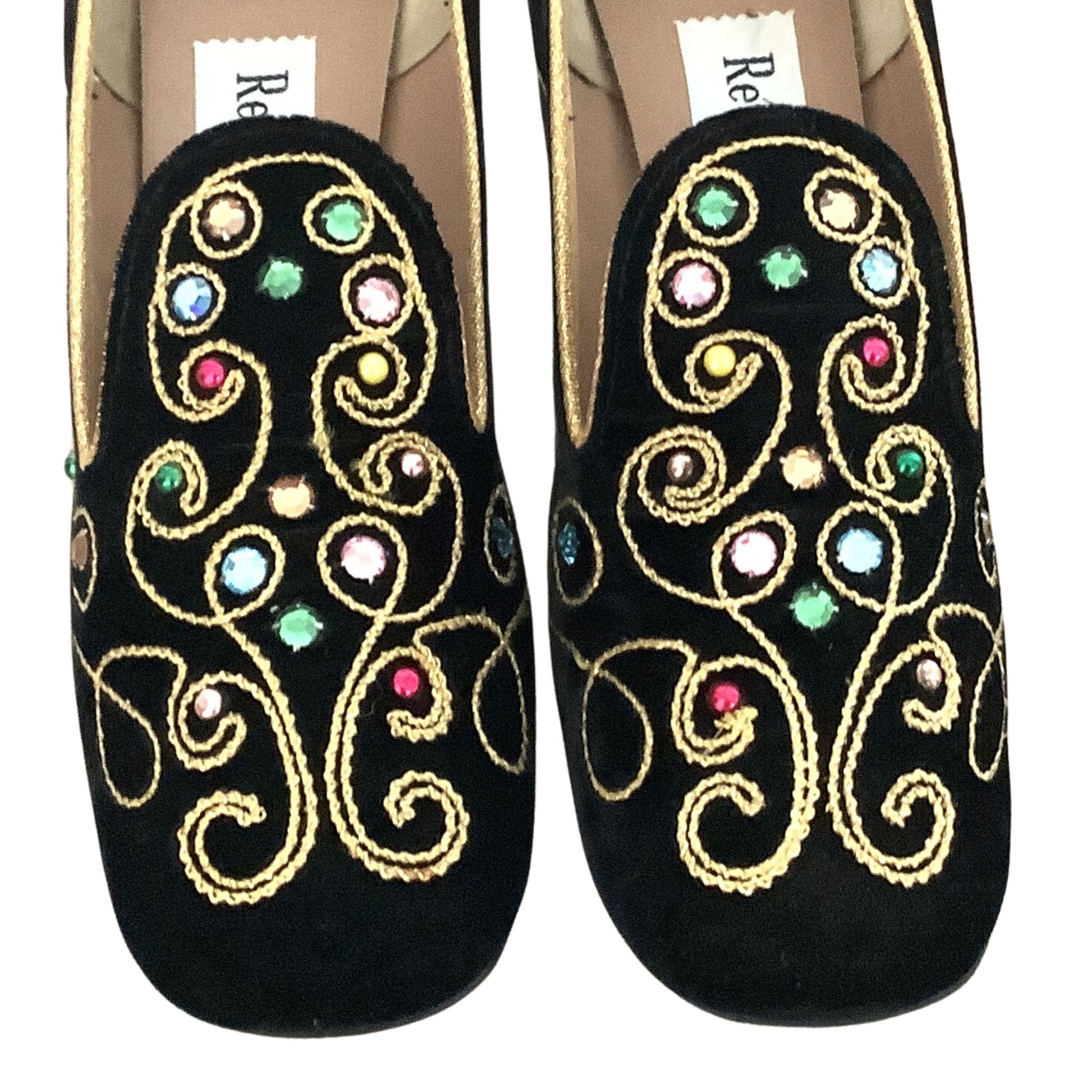 Realites black velvet loafers detail view showing gold-rope swirl and rhinestone embellishments on white background