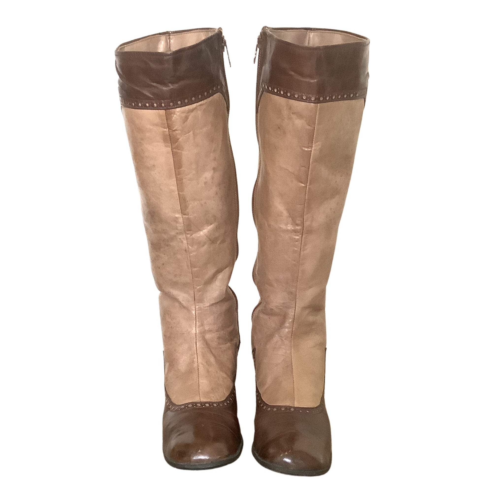 Alpine vintage steampunk boots front view with spectator brogue details on white background