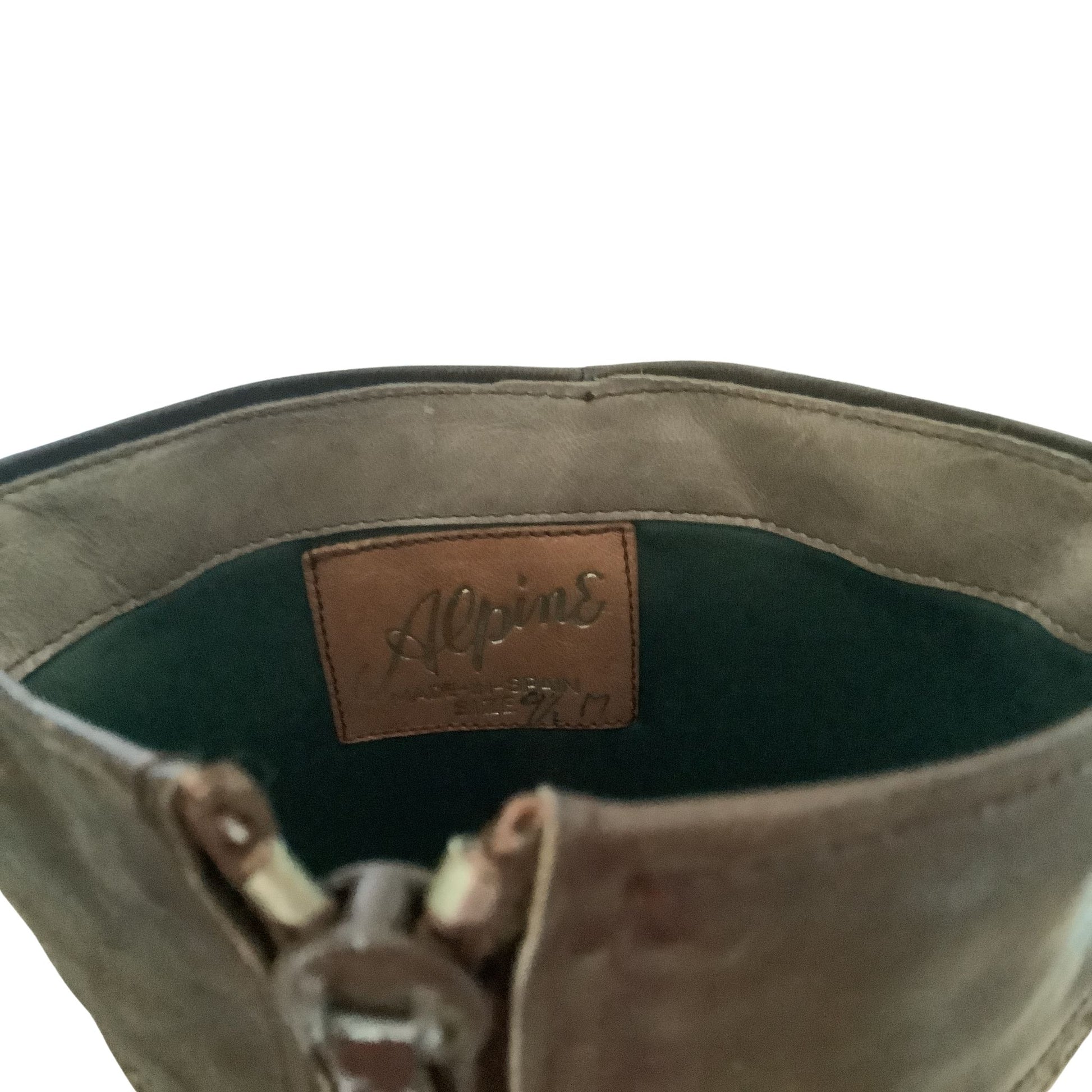 Alpine vintage steampunk boots interior tag view with brand marking on white background