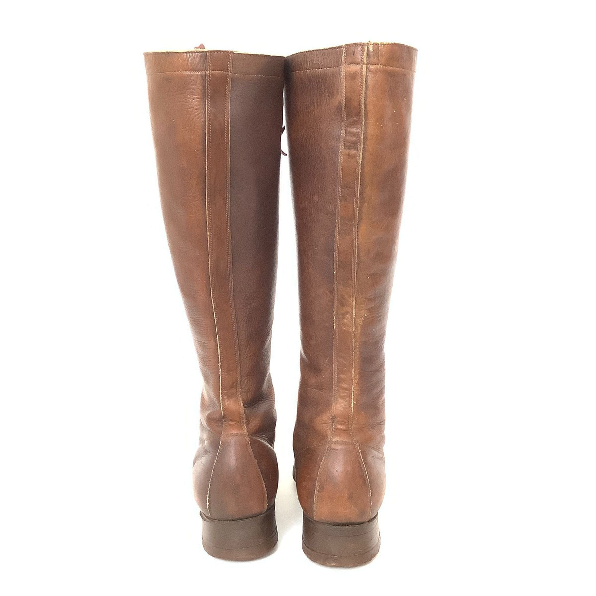 Back view of pair of brown leather boots.