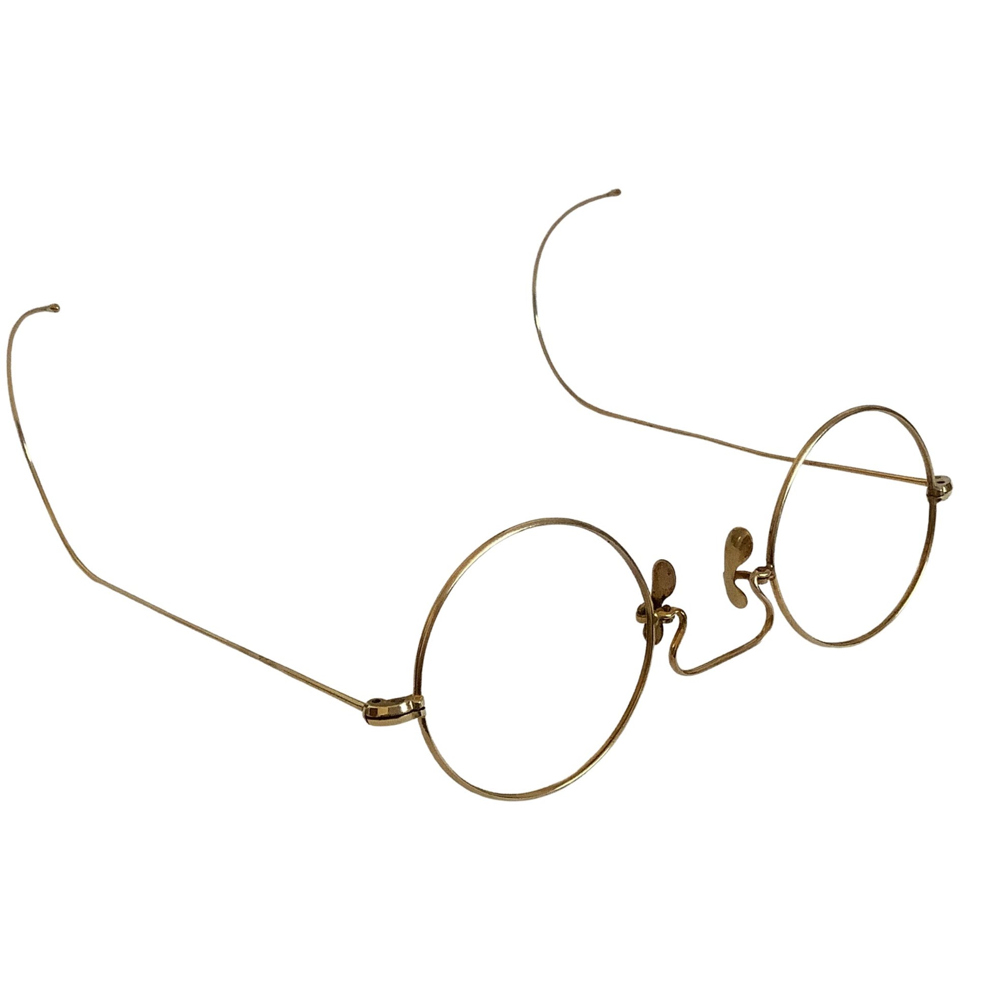Gold-rimmed eyeglasses up-side-down