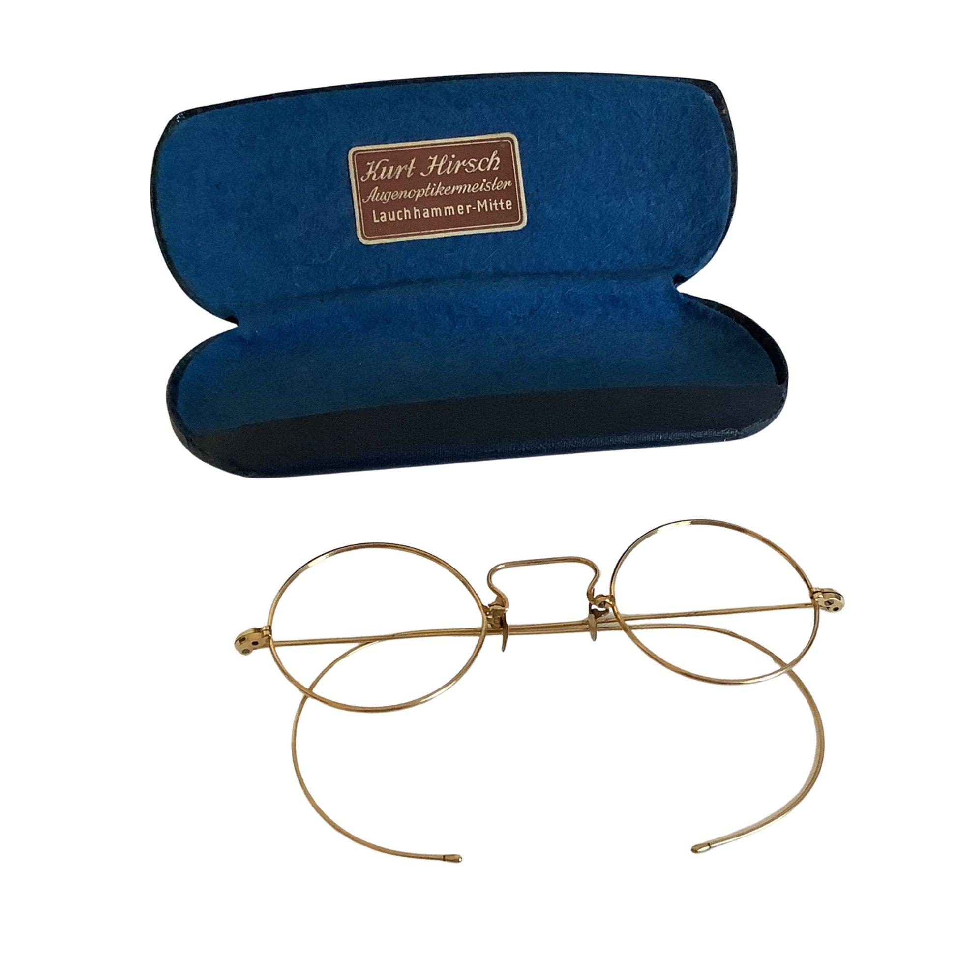 Gold-rimmed eyeglasses with a blue case