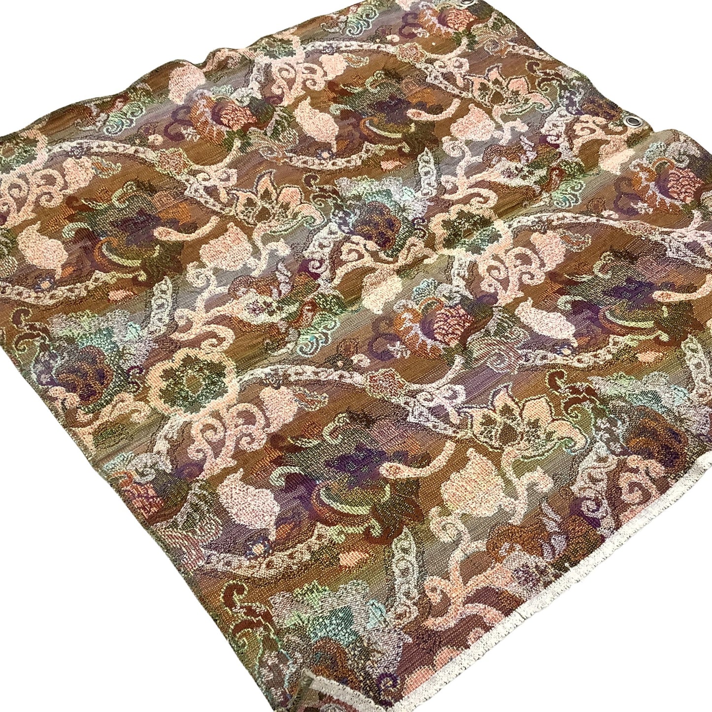Back side view of a vintage fabric sample with an intricate, ornate pattern in earthy brown, beige, purple, and green tones, laid flat on a white background.