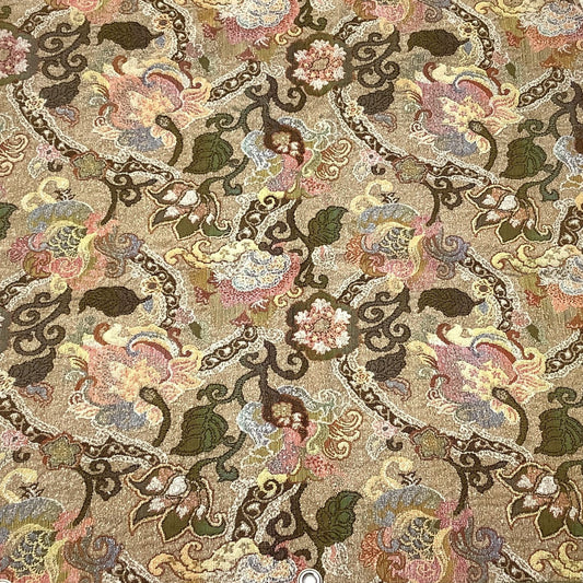 Front view of a textile vintage fabric sample in Art Nouveau pattern in beige, brown, pink, green, and blue, featuring metal grommets on the bottom edge.