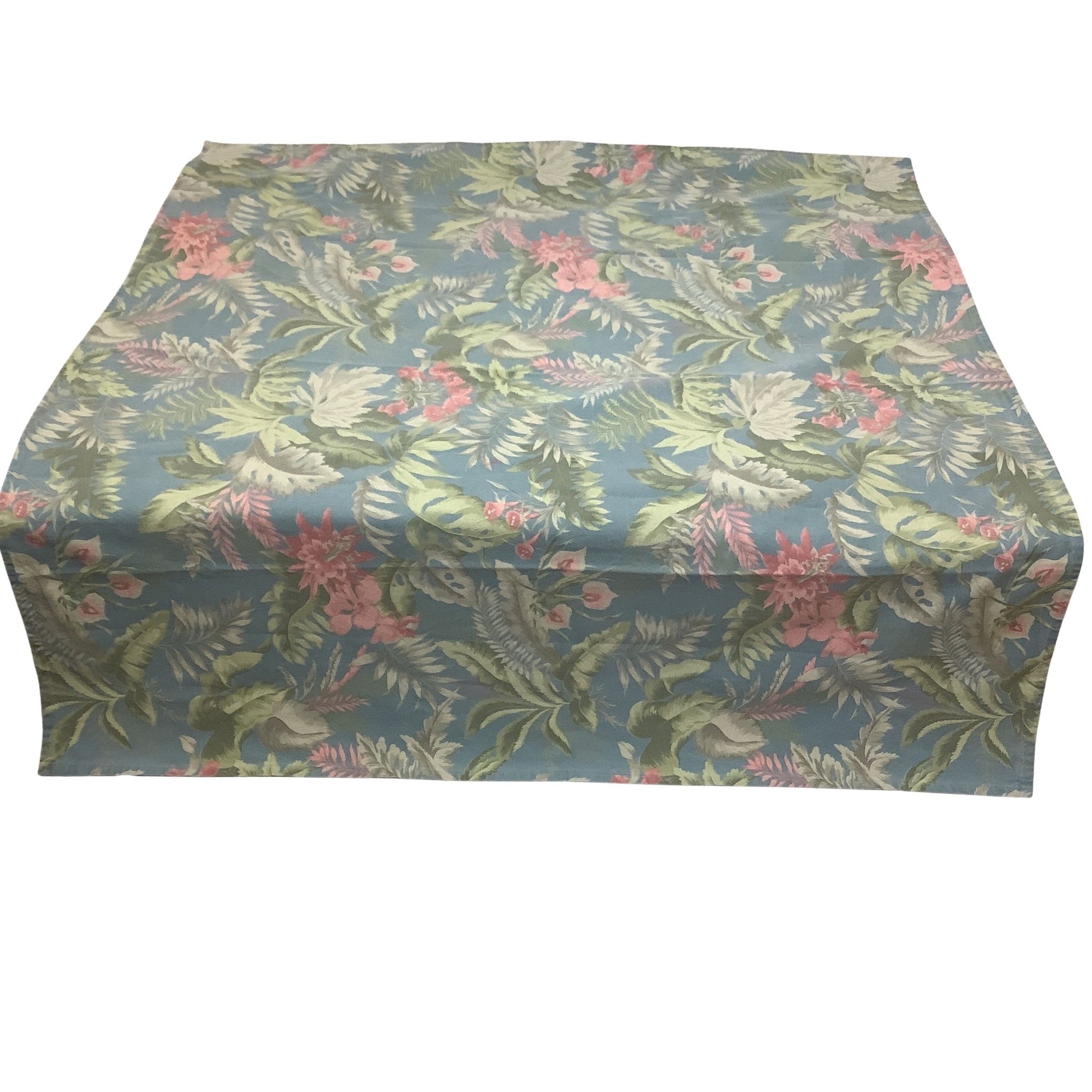Front view of a square tablecloth with a tropical floral and leaf pattern in shades of blue, green, and pink, displayed against a plain white background.