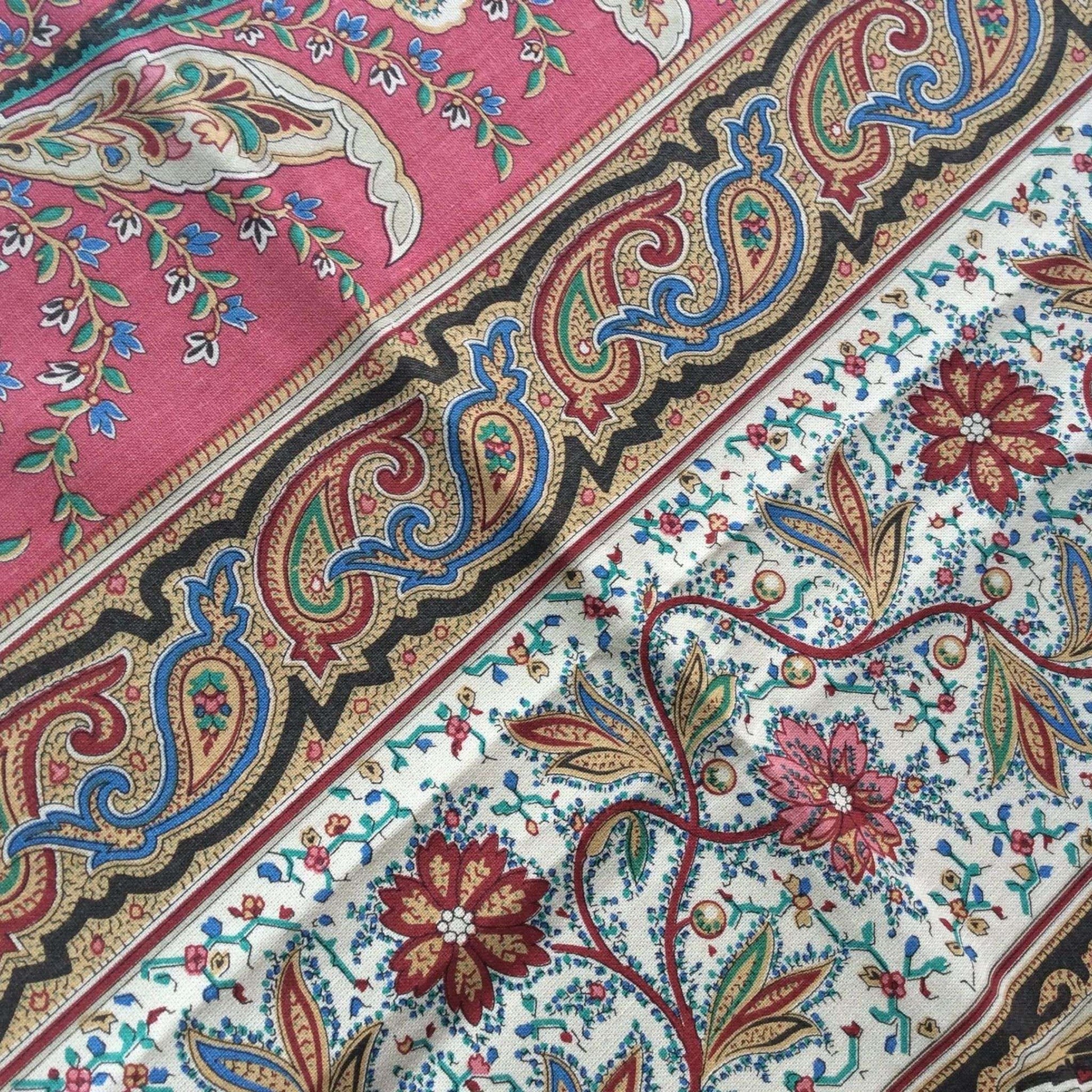 Close-up of a colorful paisley patterned fabric with intricate designs.