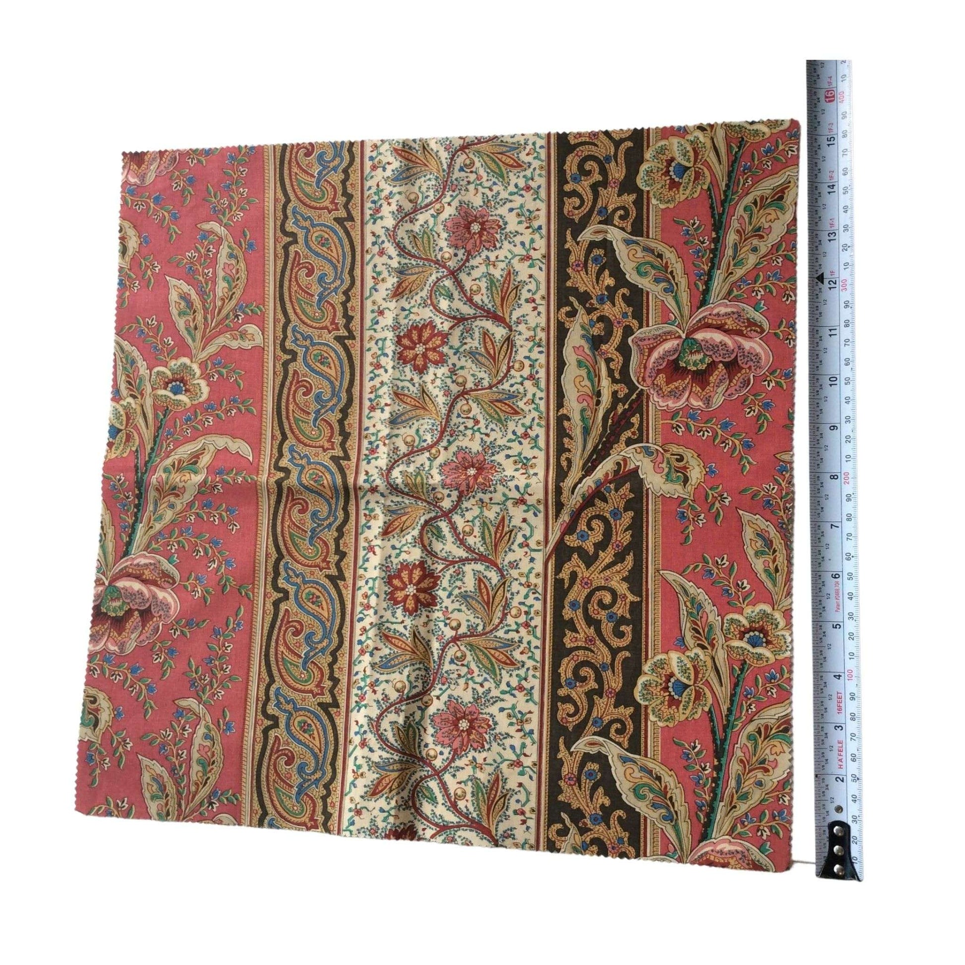 Front view of Borderline fabric with floral patterns and a ruler for scale