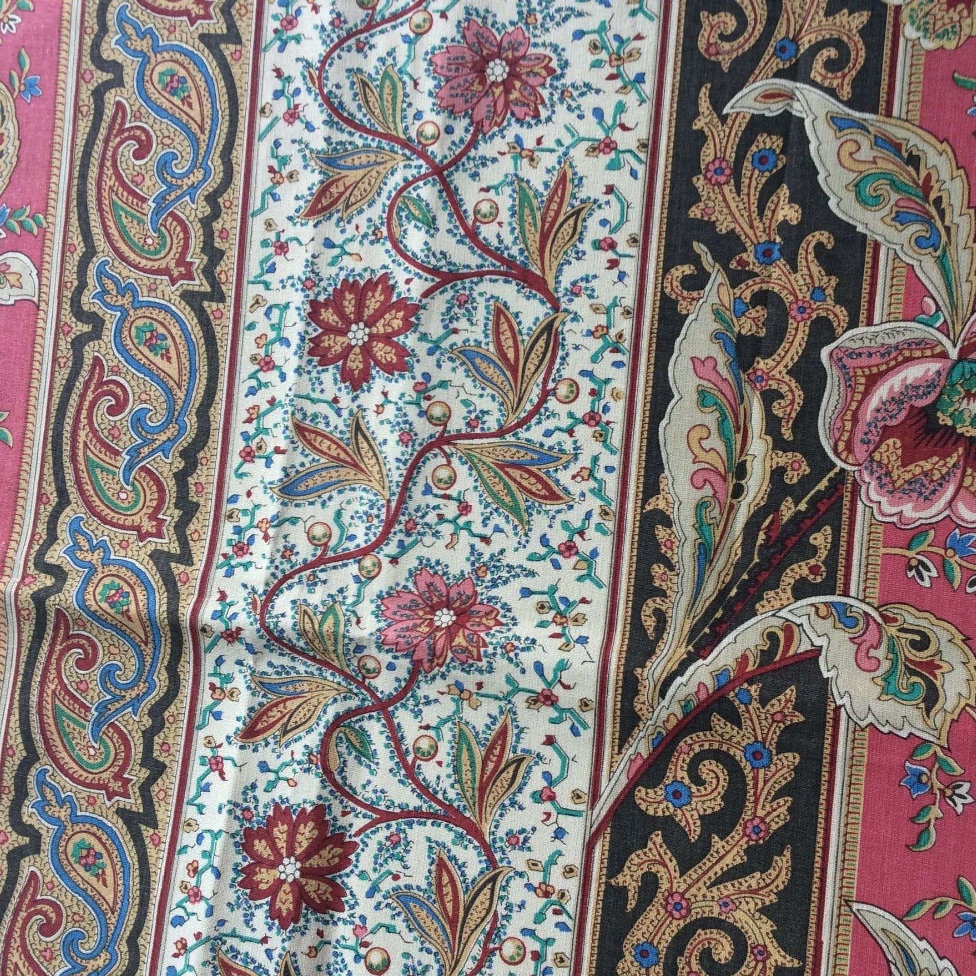 Side view of a colorful paisley patterned fabric with intricate designs.