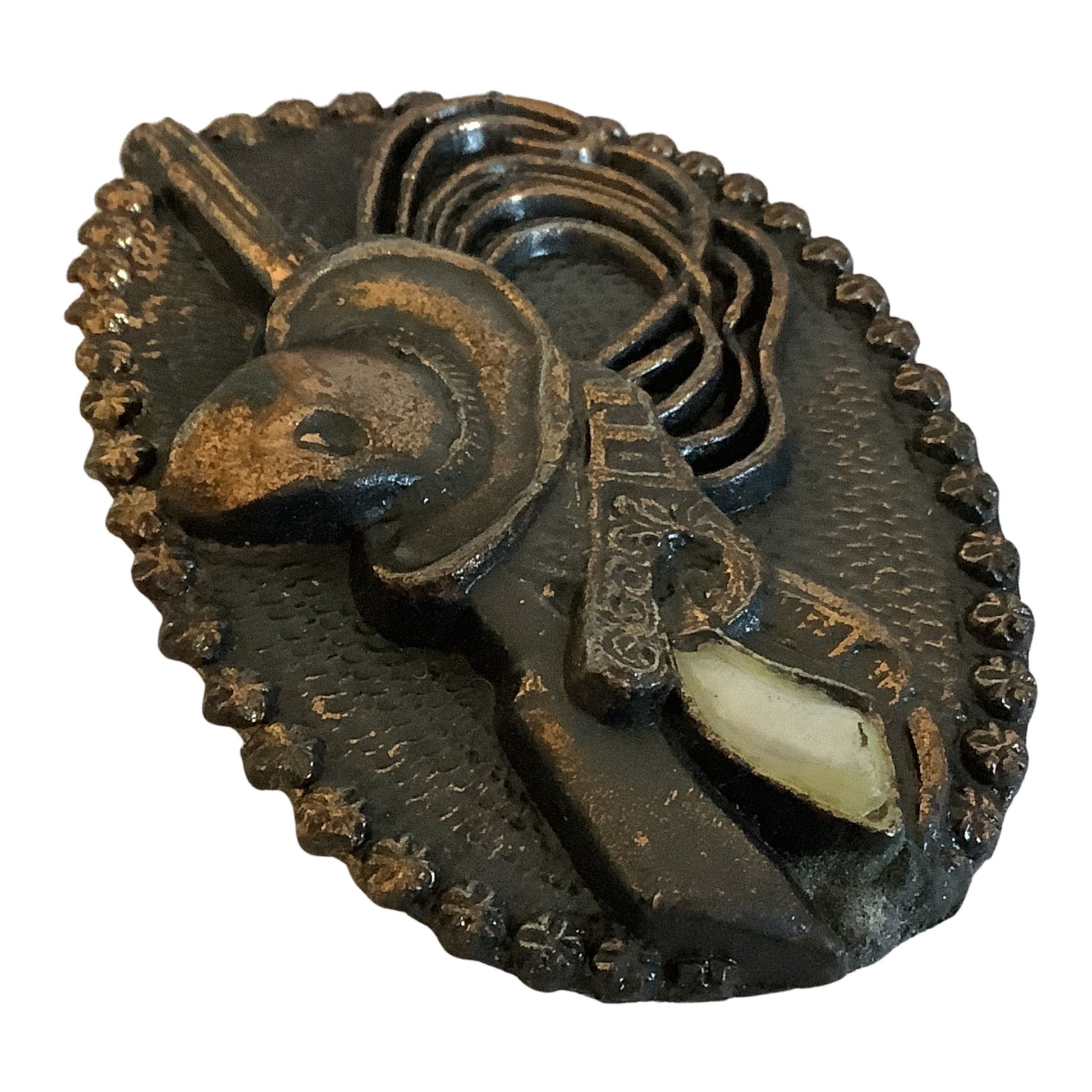 Close-up view of bronze finish cowgirl belt buckle details on a white background