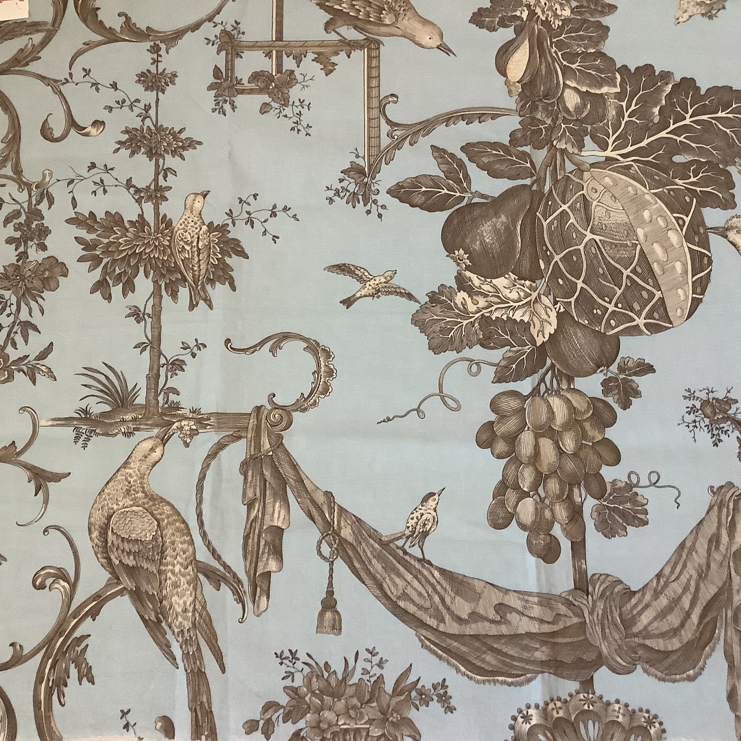 Brunschwig & Fils Kininvie baroque toile cotton fabric sample, blue ground with brown birds, botanicals, and scrollwork.

