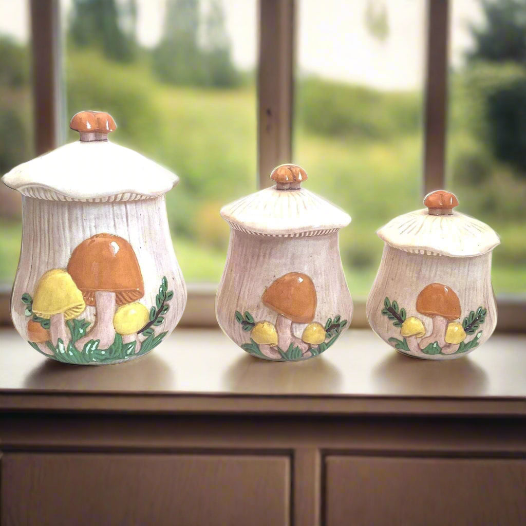 Ceramic Mushroom Canisters on window sill greenery background