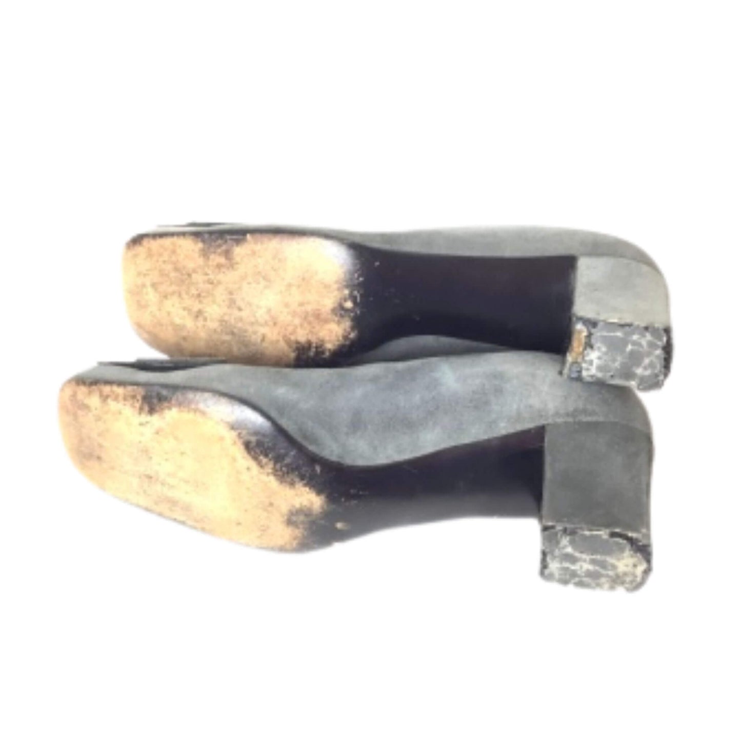 Pair of worn soles of high-heeled Christian Dior pumps
