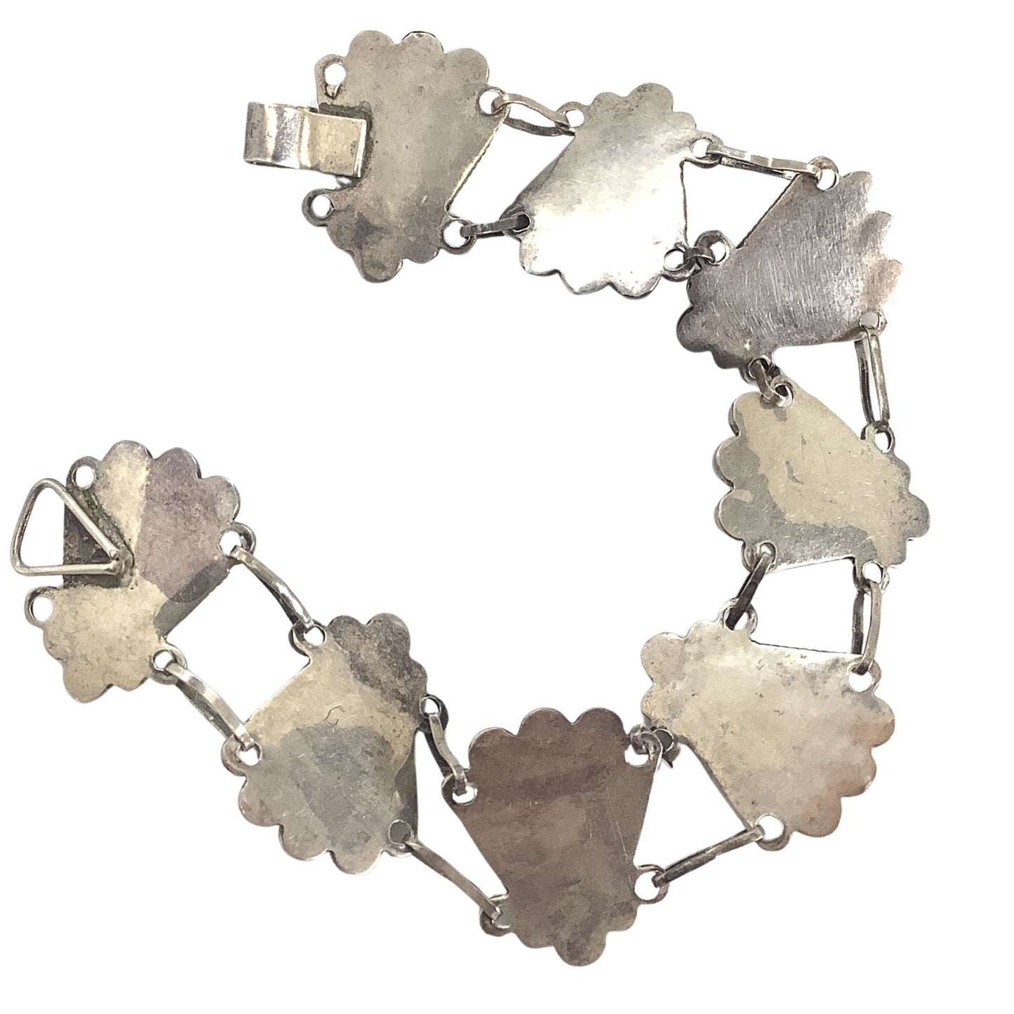 Close-up view of the back of the bracelet on a white background