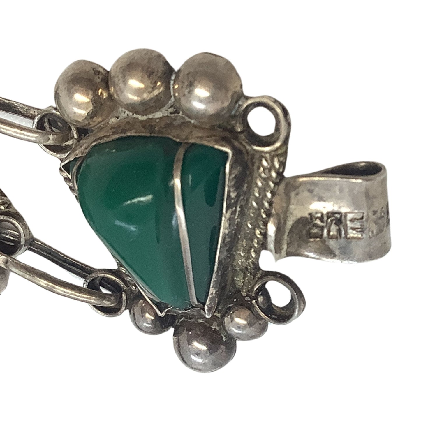 Close-up view of triangle malachite on a white background