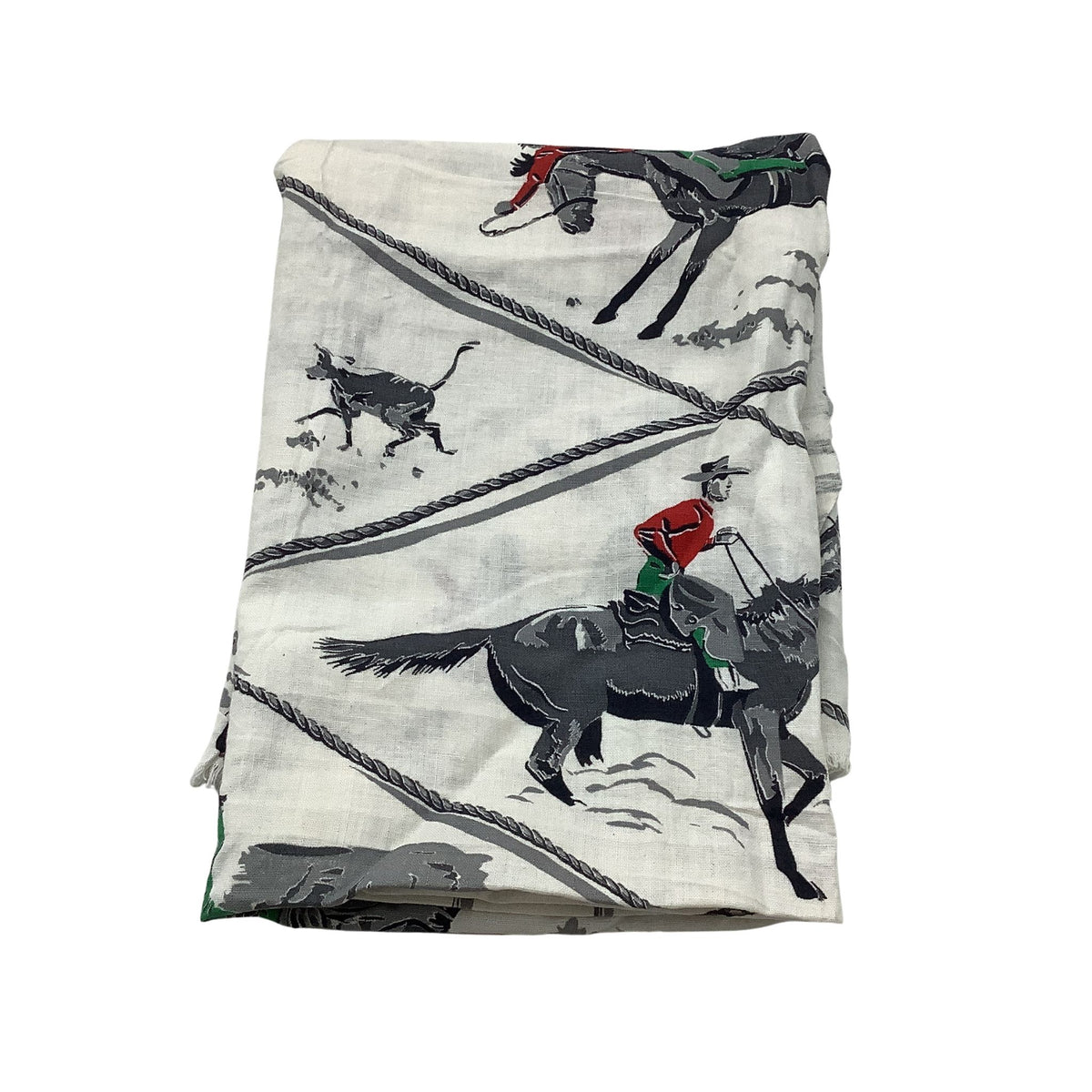 Vintage cowboy fabric folded white cotton featuring a rustic western print of black horses, riders in red and green, and gray rope details.