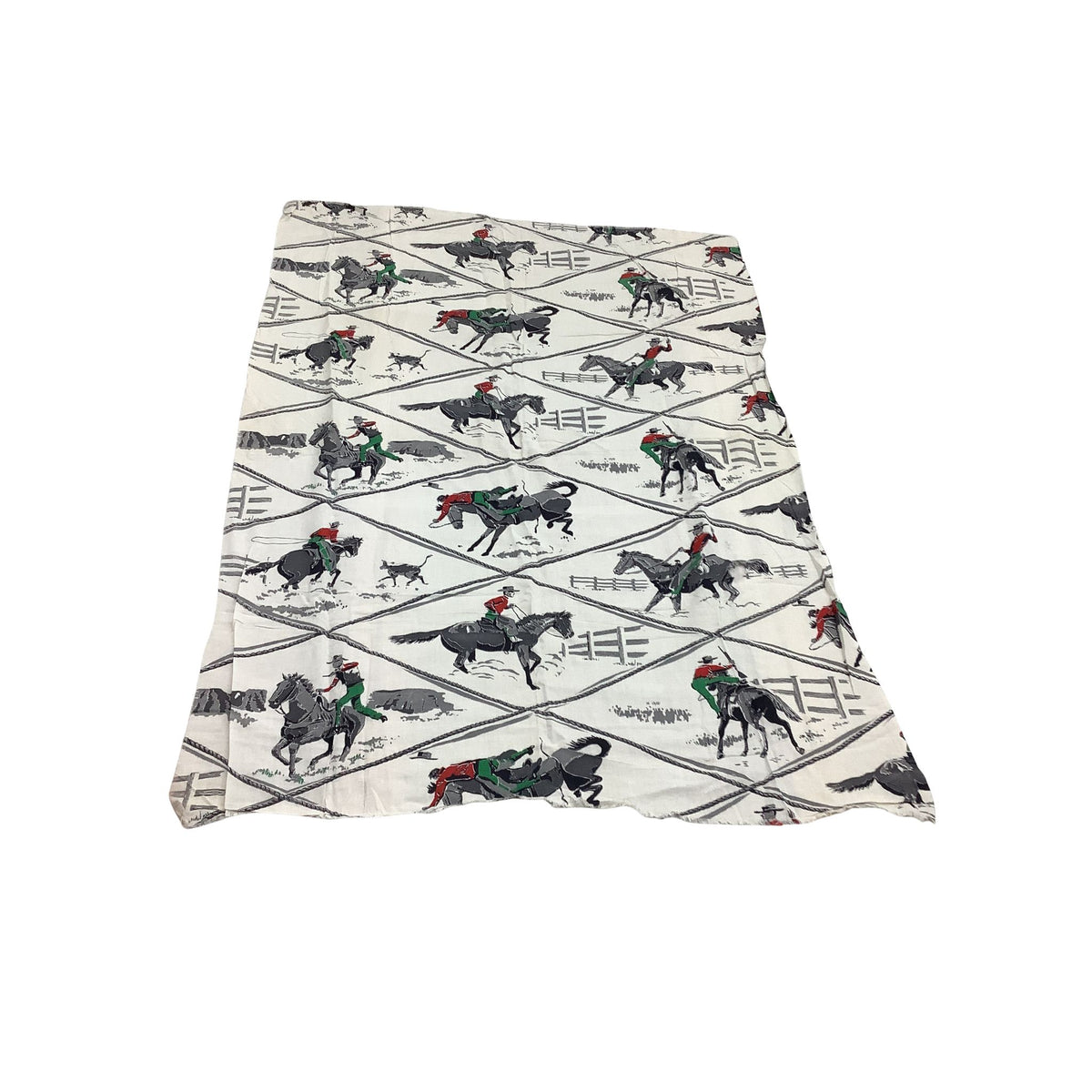 Overview of vintage cowboy fabric in white cotton featuring a rustic western print of black horses, riders in red and green, and gray rope details. 