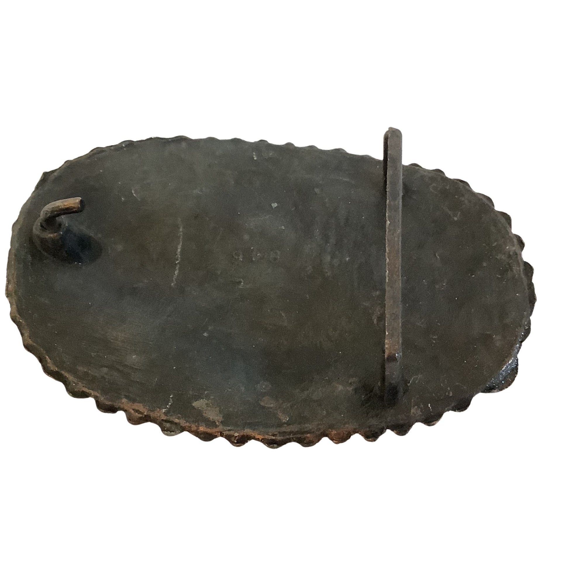 Back view of cowgirl western belt buckle showing attachment on a white background