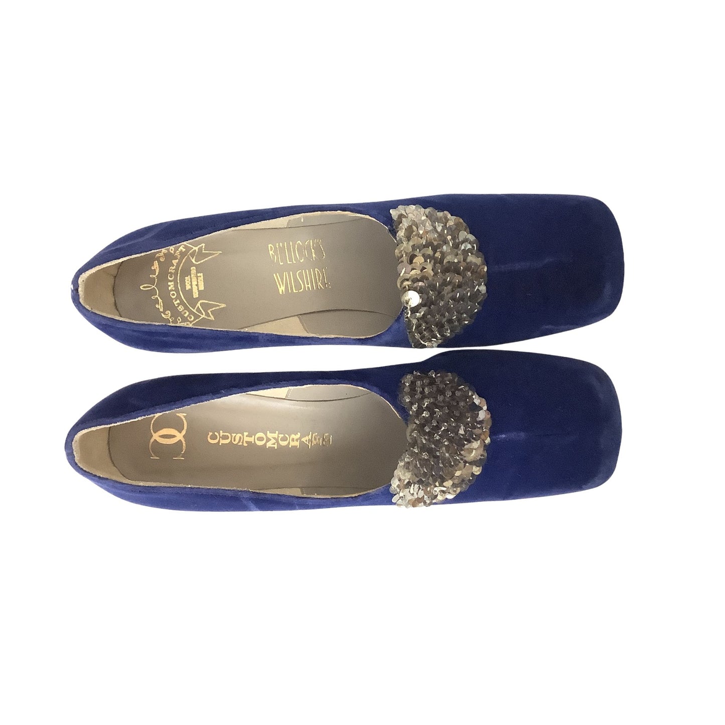 A pair of royal blue velvet Custom Craft heels with a silver sequined decorative accent on the toe, displayed against a solid white background.