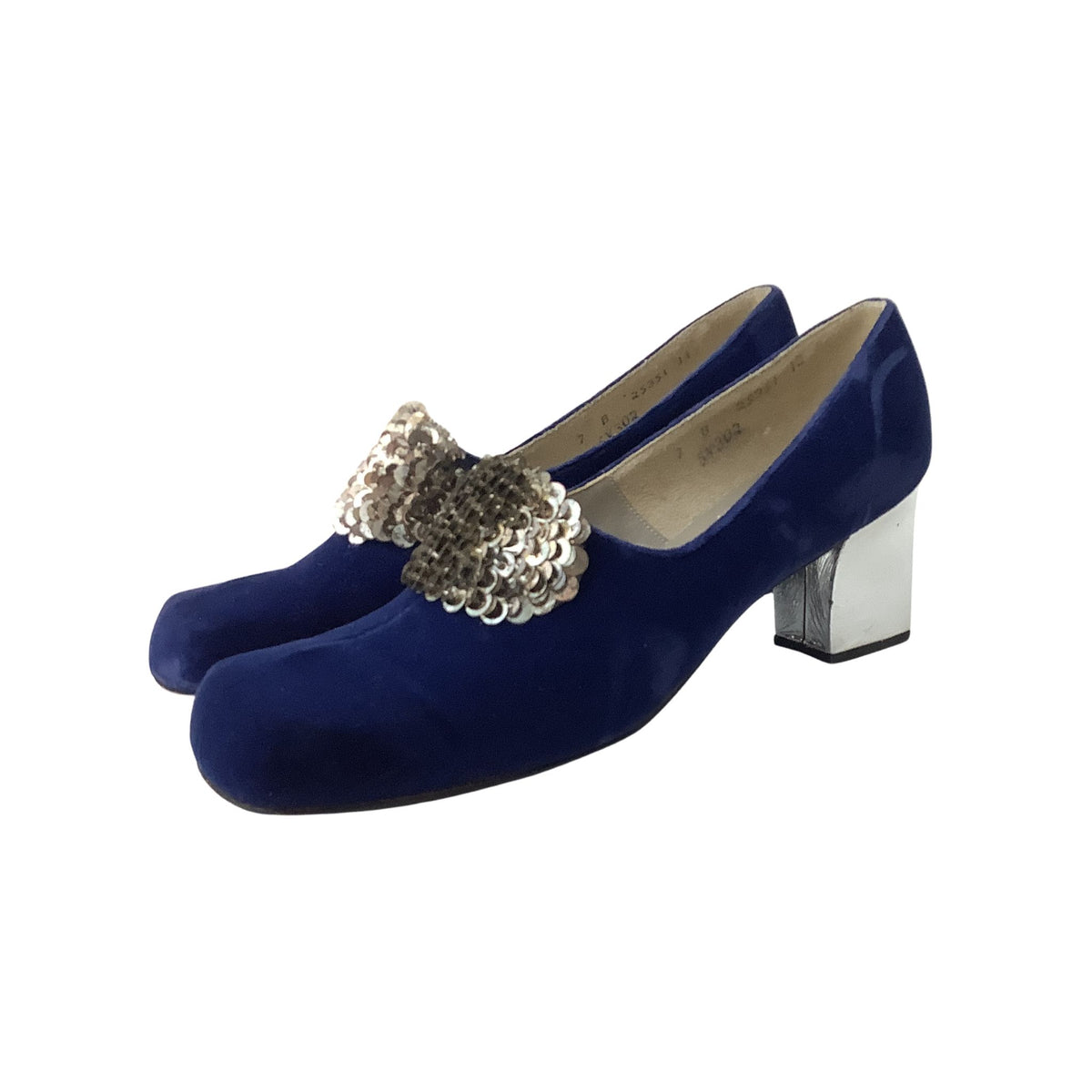 A pair of Custom Craft heels in royal blue velvet with block-heel featuring a decorative silver sequin bow detail across the vamp, shown against a plain white background.