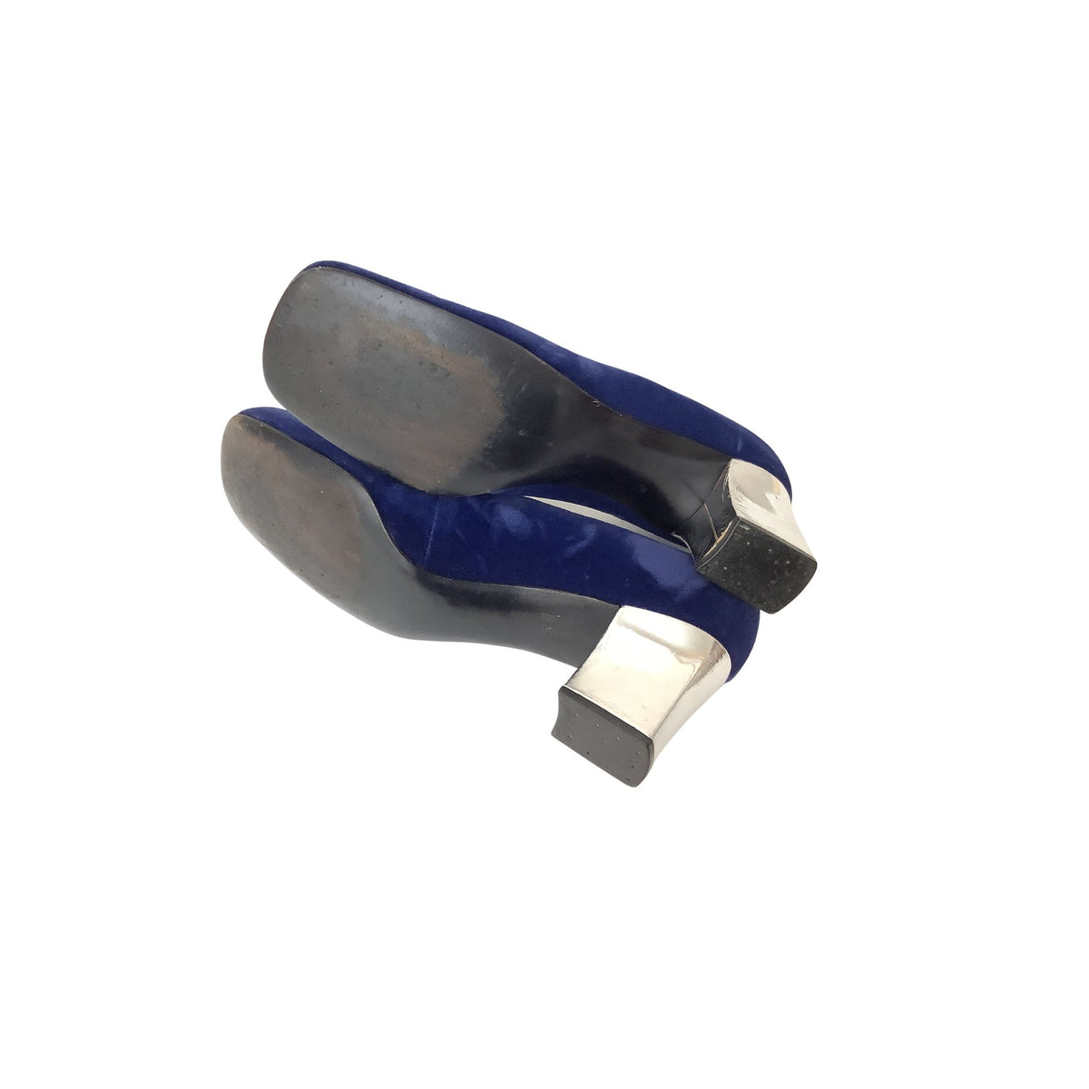 A pair of vintage Custom Craft mid-size heel shoes shown from the sole side, featuring navy blue uppers with silver-toned metal heels and dark soles, set against a plain white background.