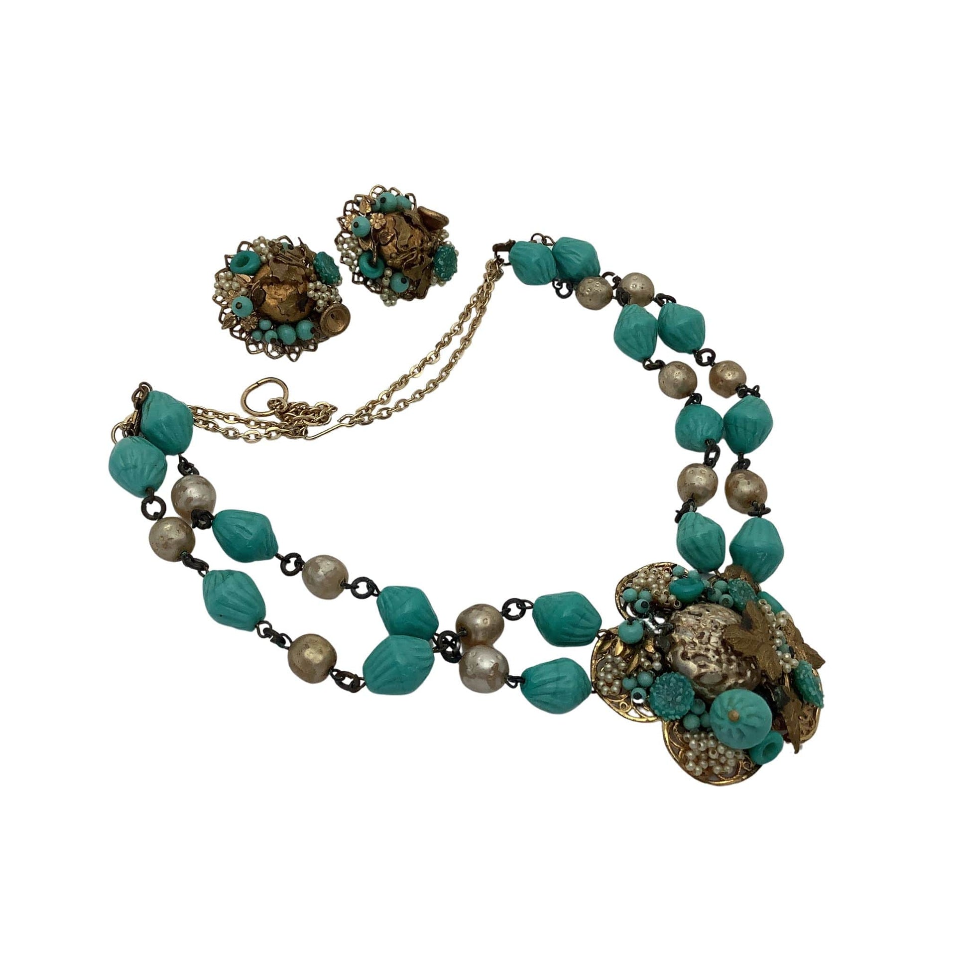Jewelry set with necklace and earrings featuring turquoise and gold tones on a white background