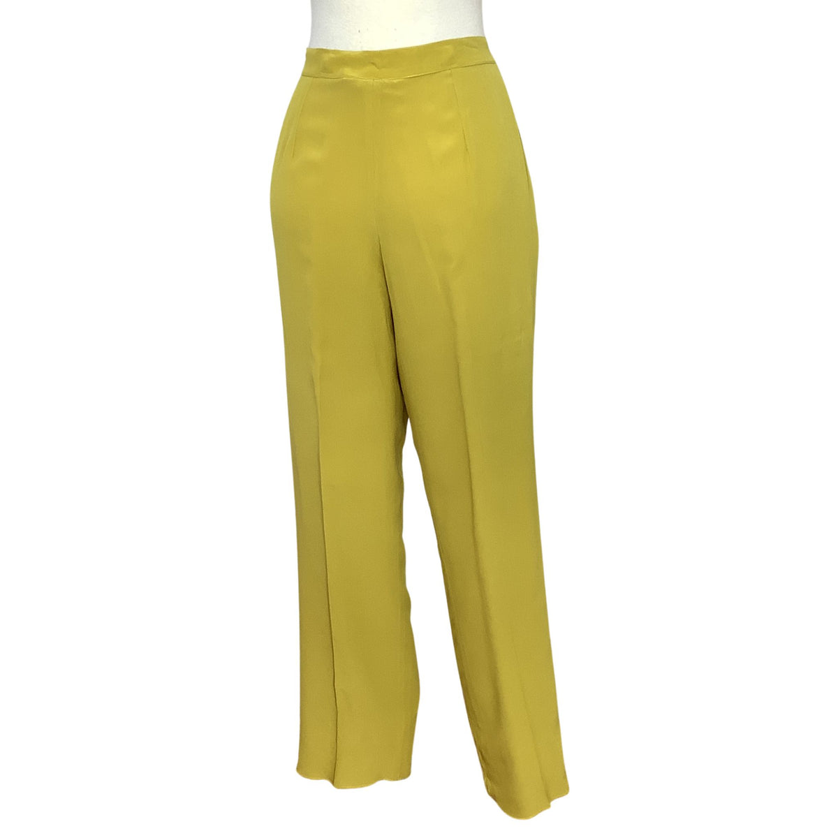 Vintage Donna Mizar wide-leg trousers in a solid chartreuse green color, displayed on a white mannequin torso against a plain white background.