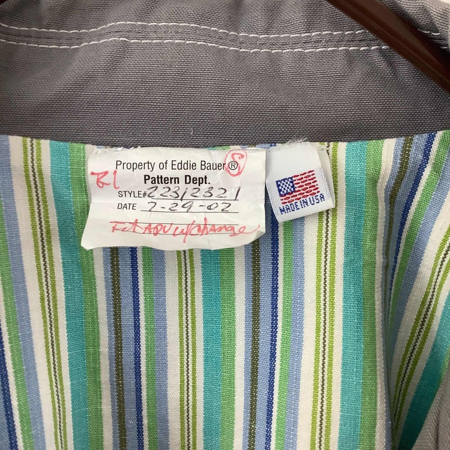Close-up of a label on a striped fabric with 'Made in USA' tag.