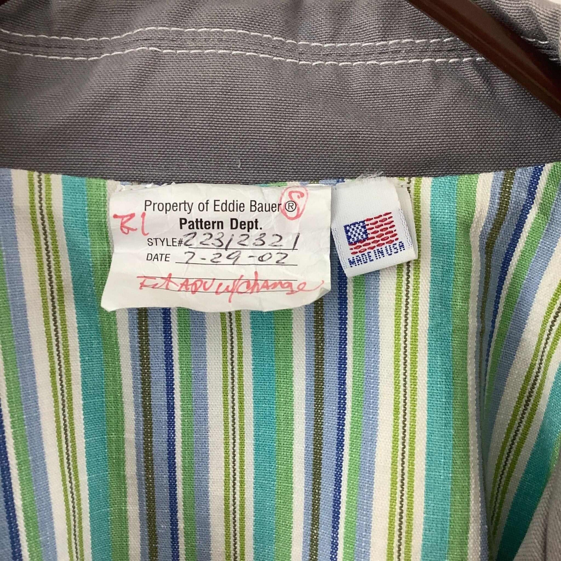 Close-up of a label on a striped fabric with 'Made in USA' tag.