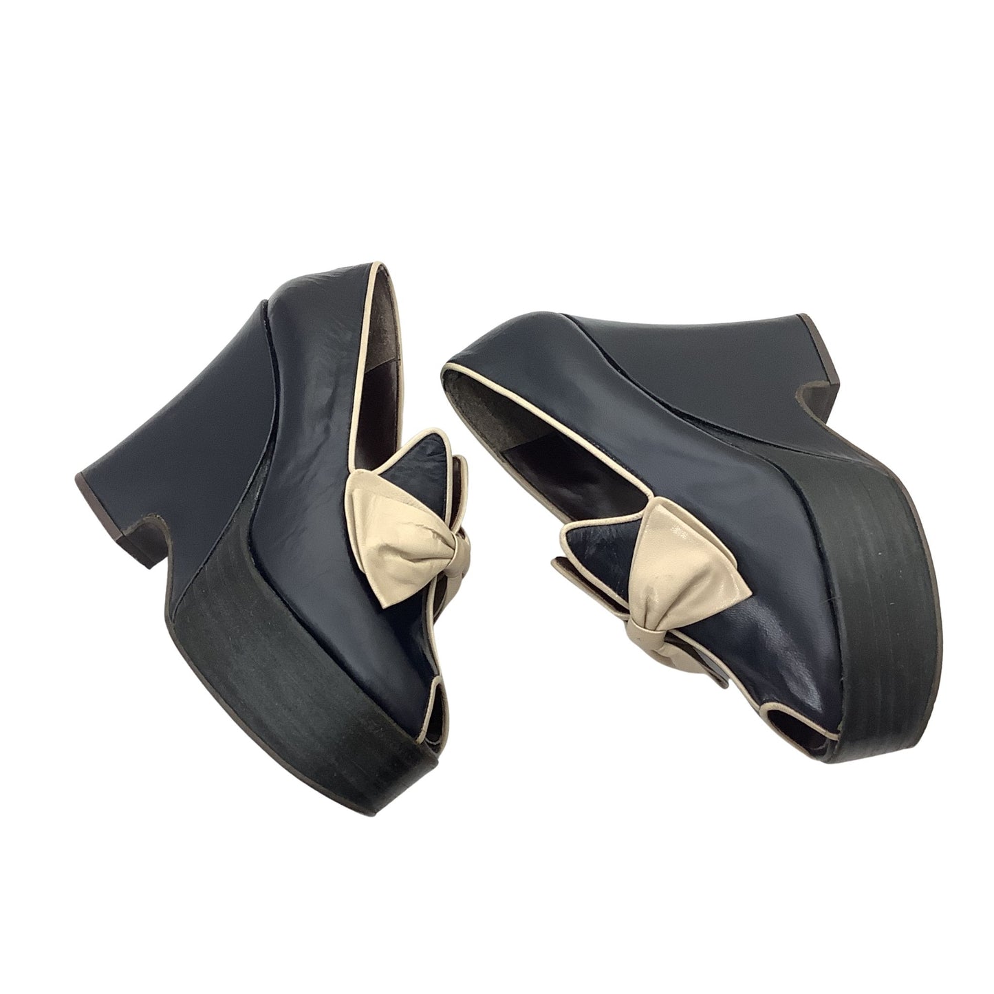Vintage Elditas platform wedge pumps with beige bow details, shown in a flat-lay style.