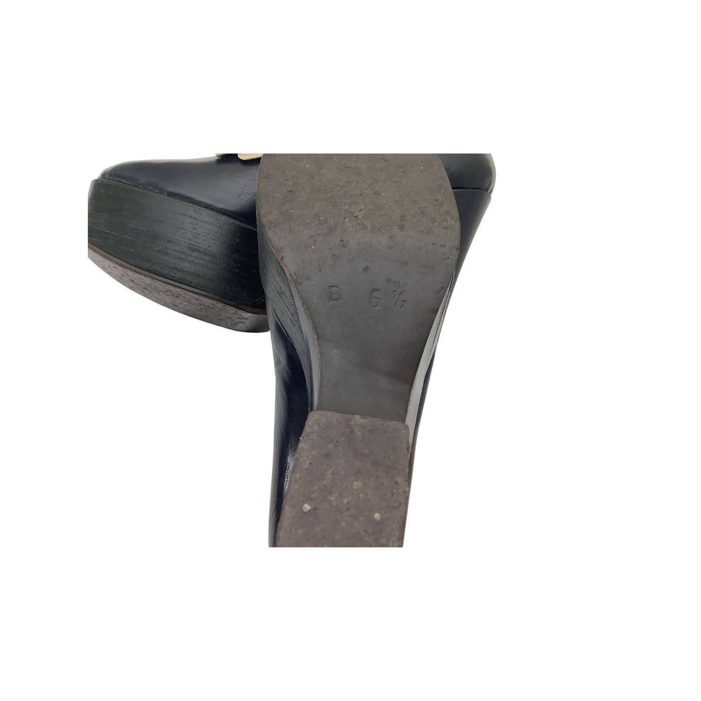 Close-up of the heel and sole showing shoe size.