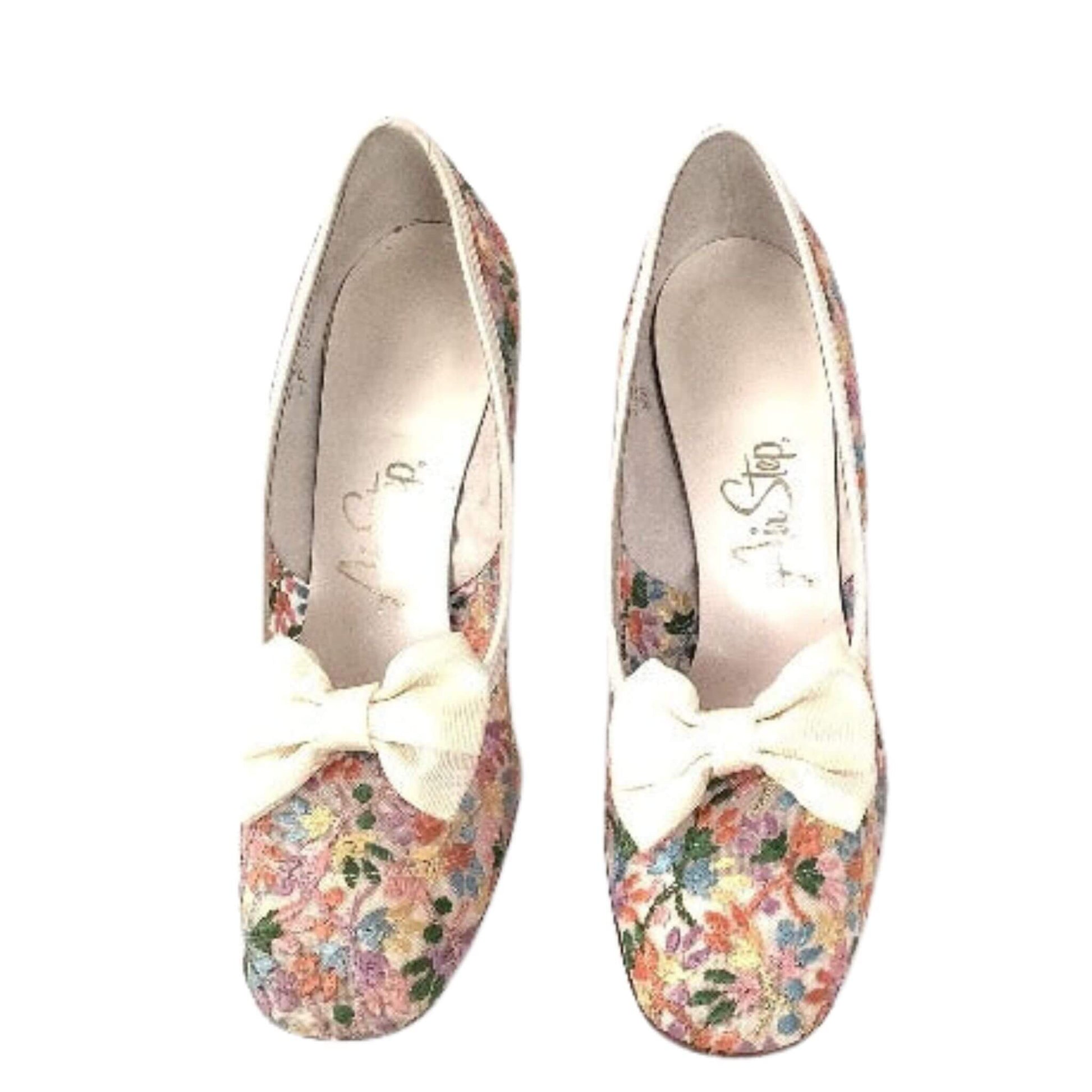 Embroidered pumps with white bows top view