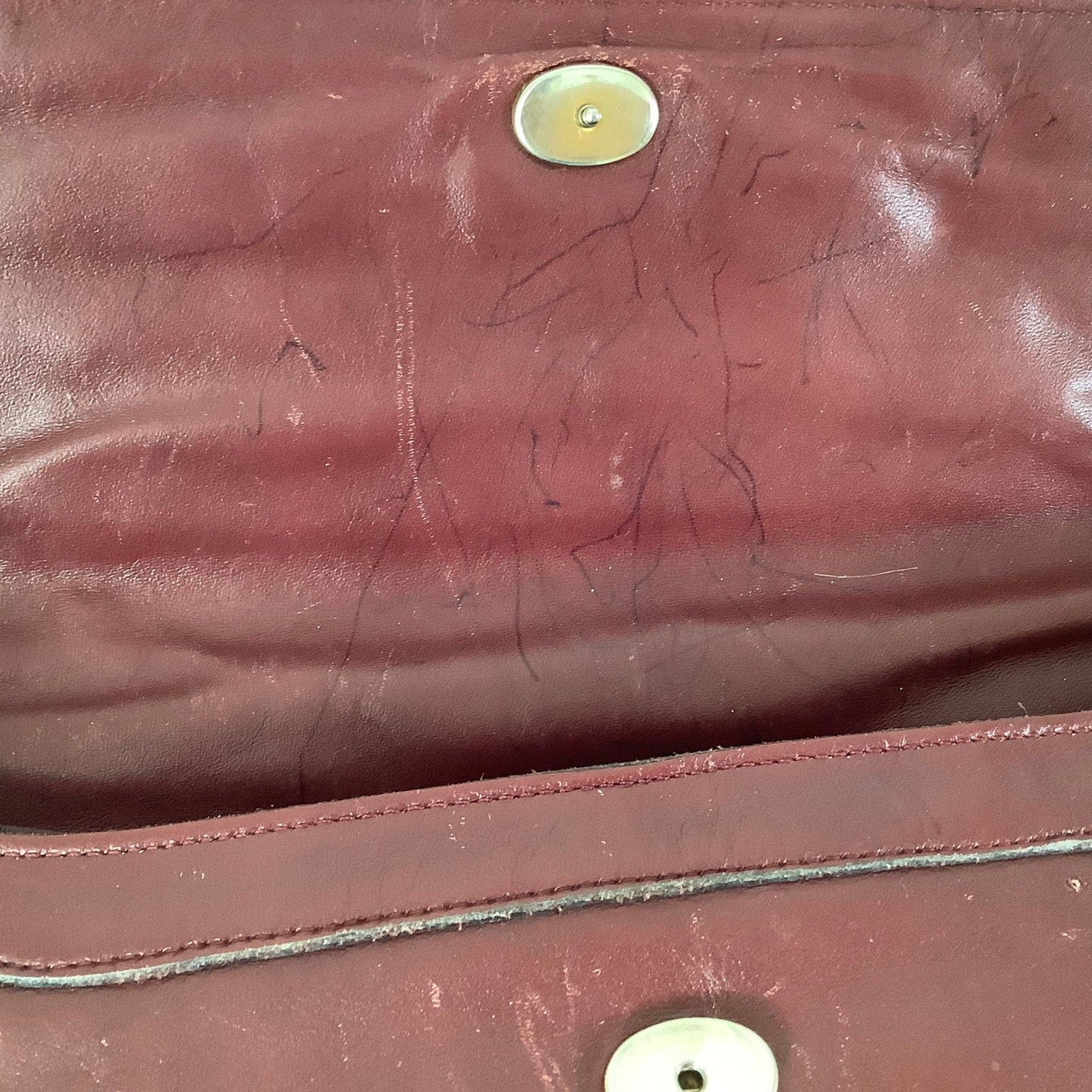 Closure mechanism on Etienne Aigner convertible clutch bag