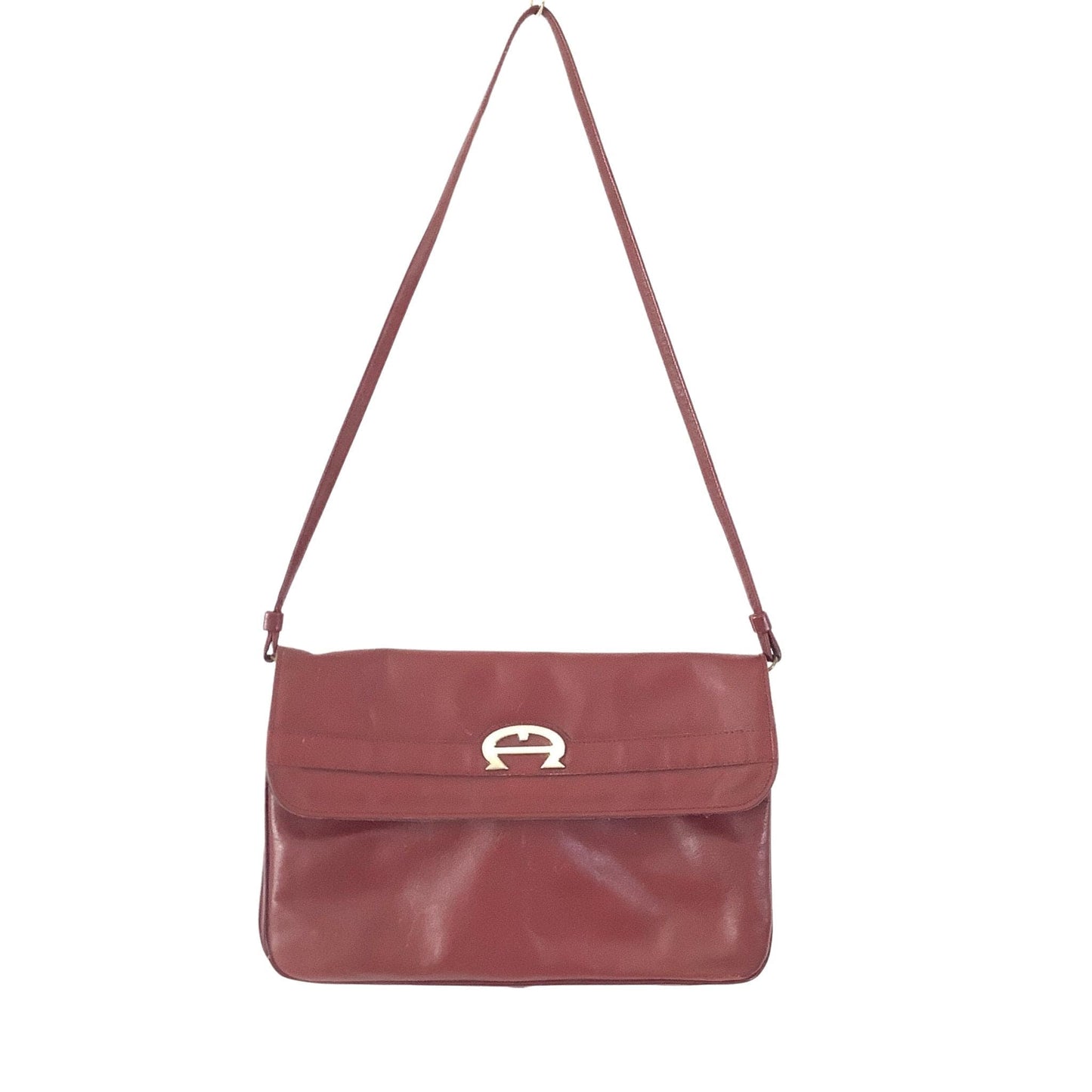 Front view of Etienne Aigner convertible clutch bag showing design details