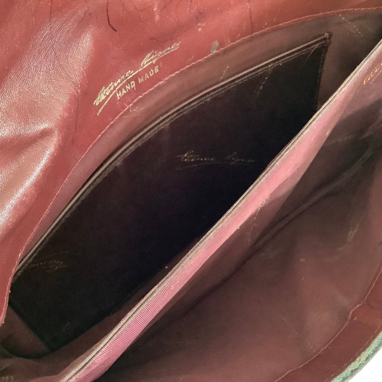Interior view of Etienne Aigner convertible clutch bag showing compartments