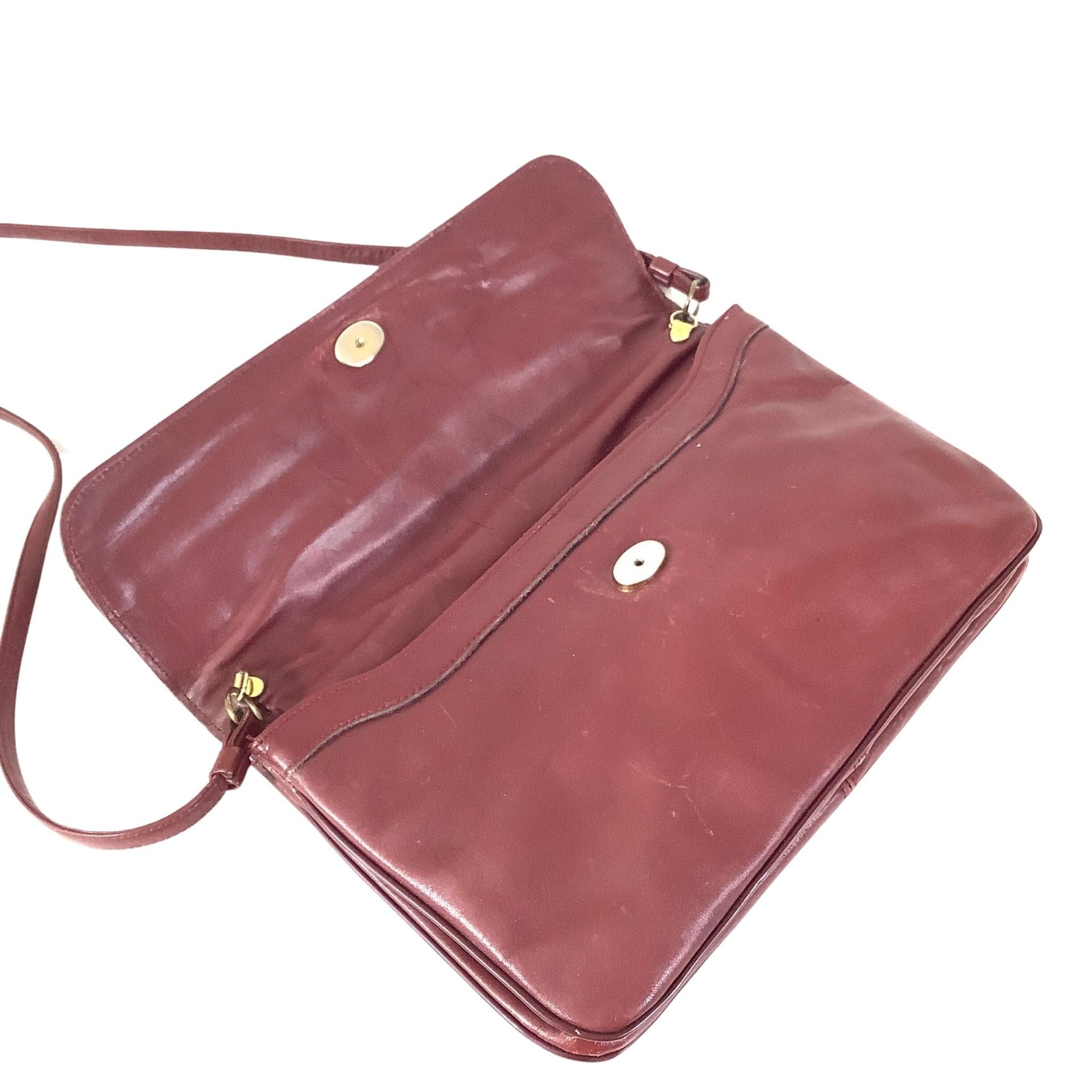 Convertible strap detail on Etienne Aigner clutch bag