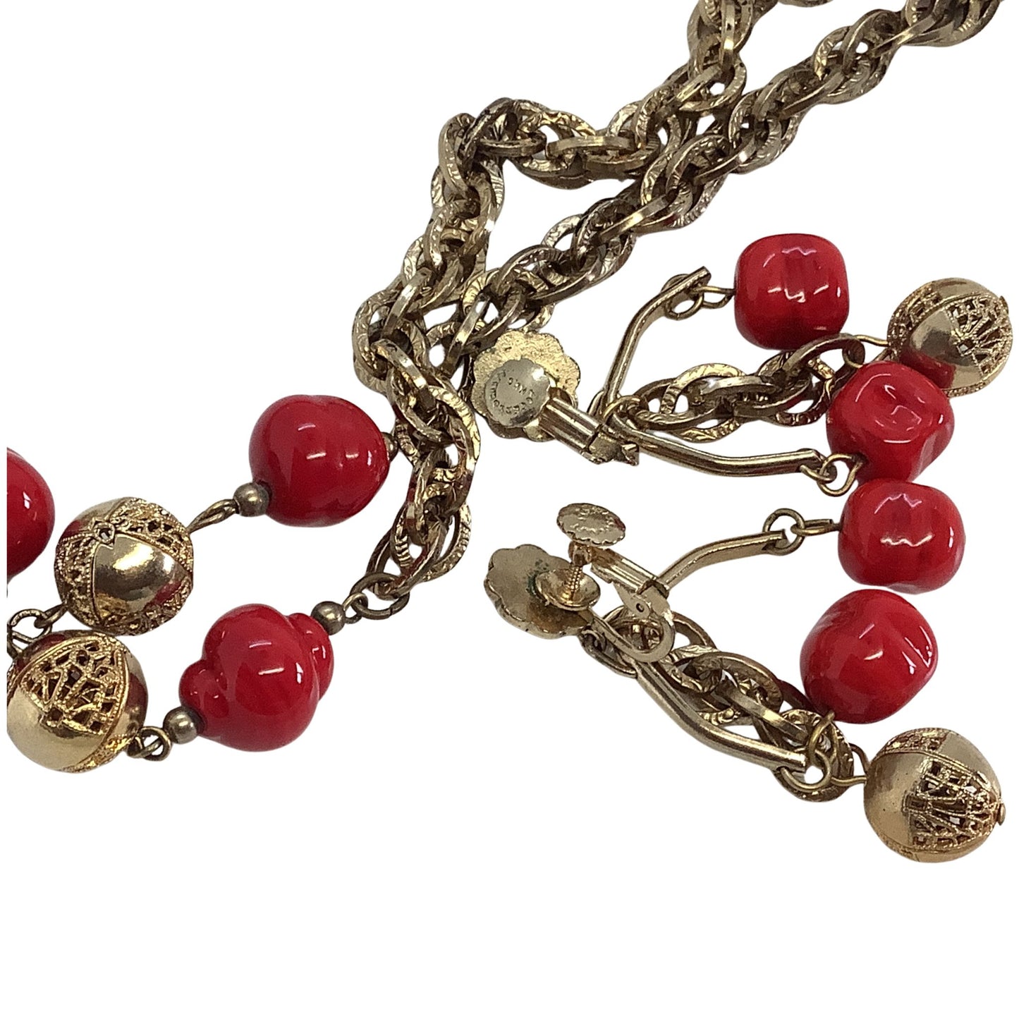 Faux Coral Chandelier earrings closeup  on a white background