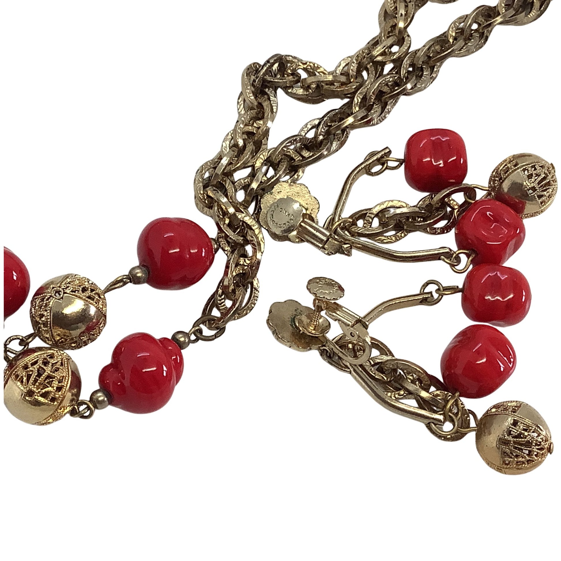 Faux Coral Chandelier earrings closeup  on a white background