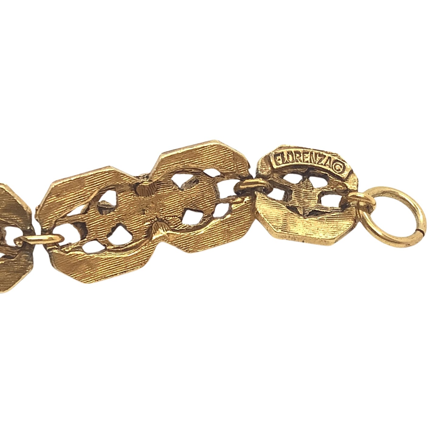 Florenza gold tone metal bracelet showing brand logo on a white background