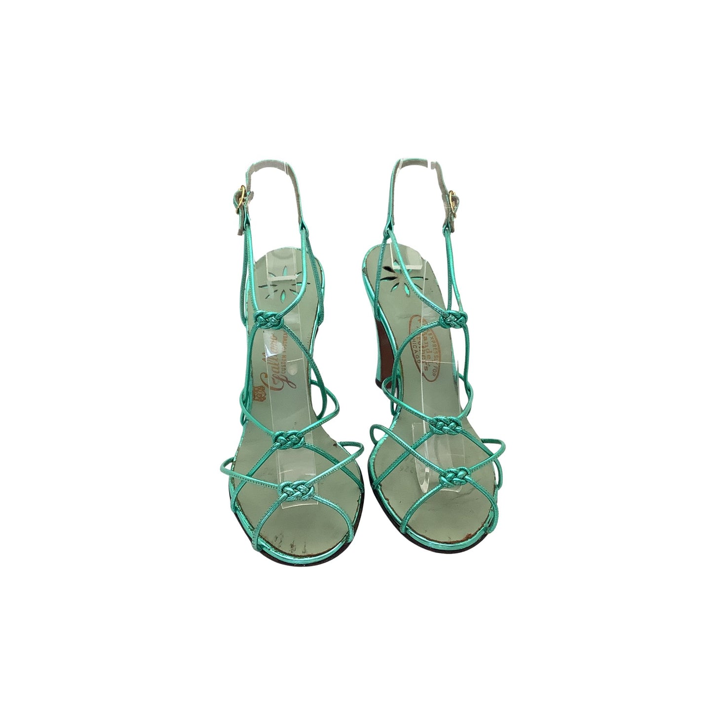 Front view of a pair of green-turquoise strappy high-heeled shoes on a white background