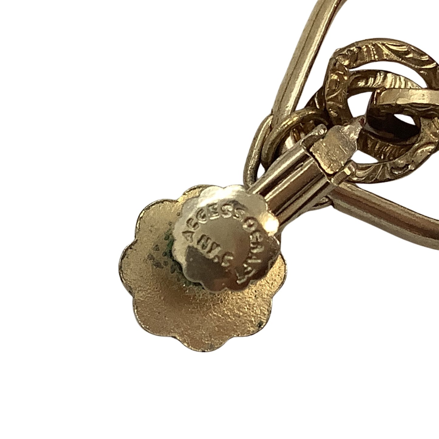 Gold earring with a visible brand logo on a white background