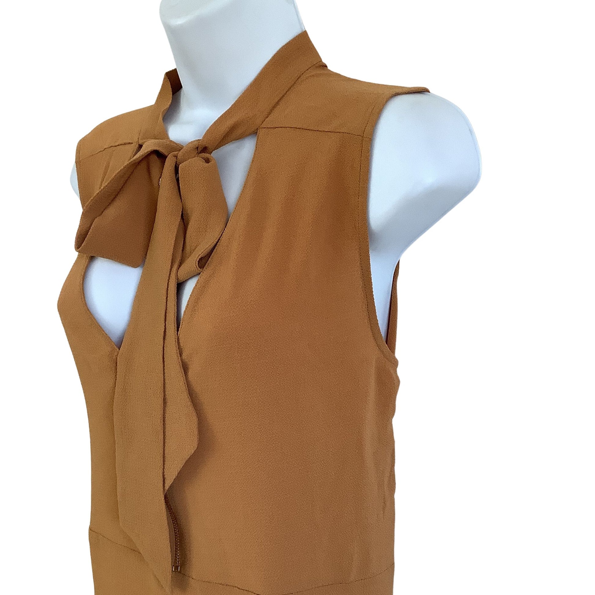 Mustard sleeveless top sleeveless view on a mannequin against a white background